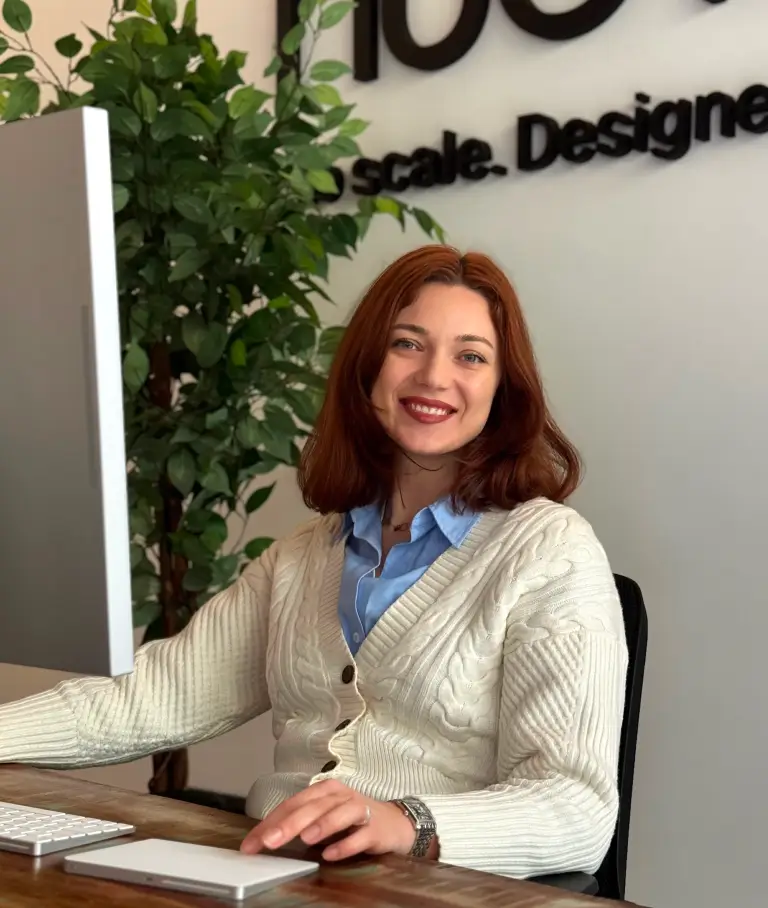 A smiling handsome woman in a cafe