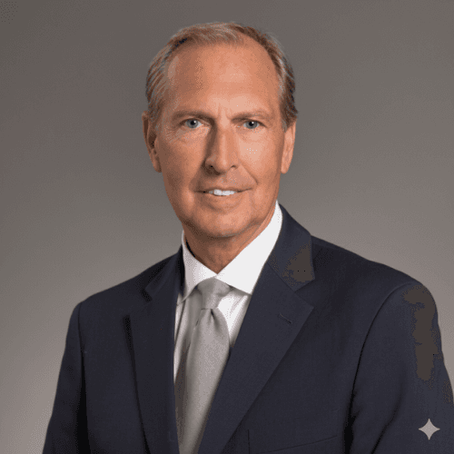 Golden retriever dog is being petted by a person. The dog is lying down, enjoying the human interaction.