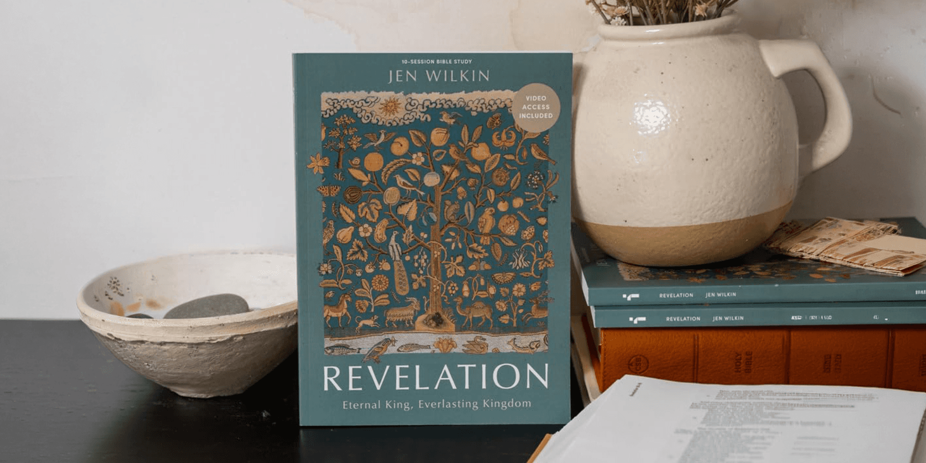 Book on a desk with decorative items