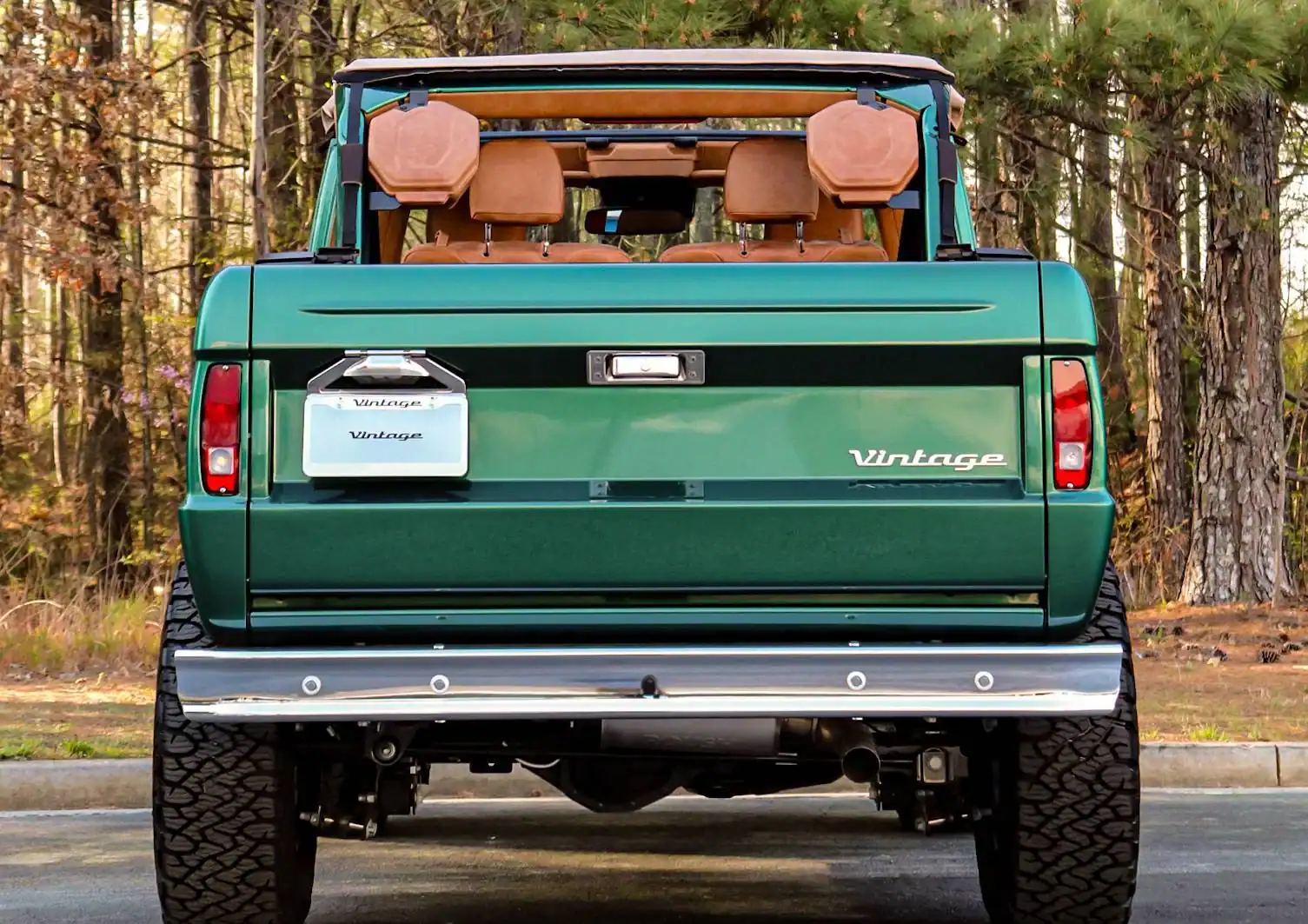 a person swimming in the water with grass