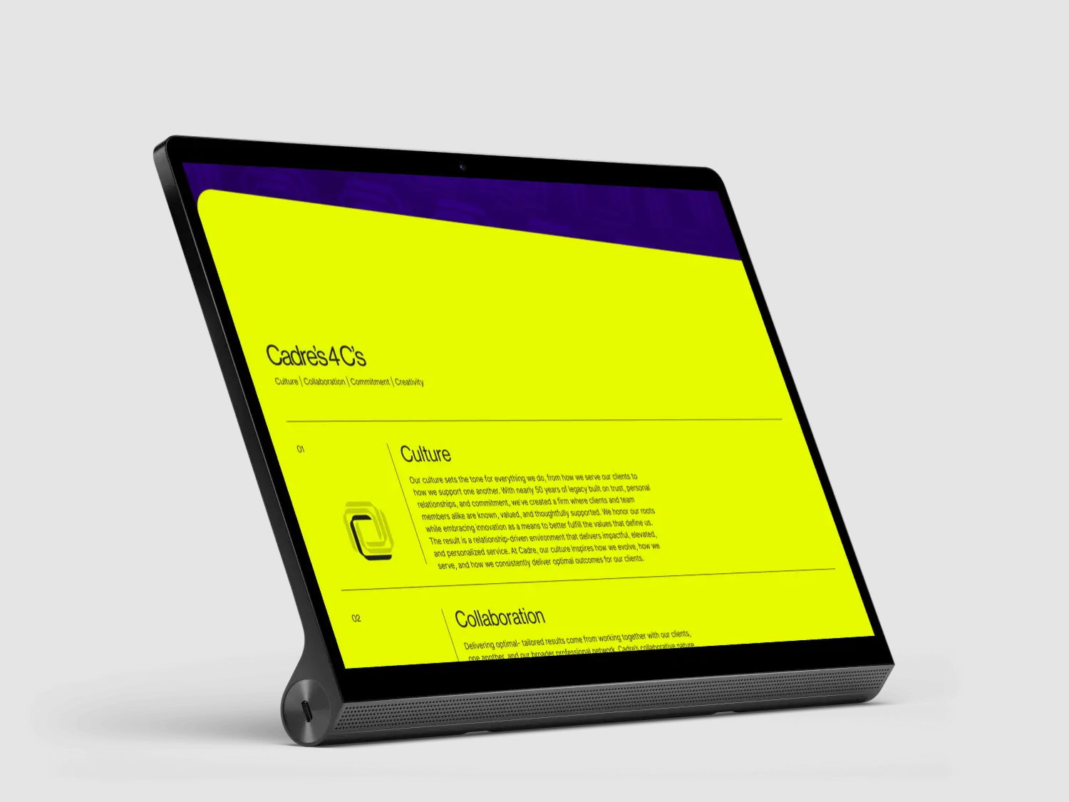 A tablet device displaying a bright yellow screen with text and graphics, set against a black background.