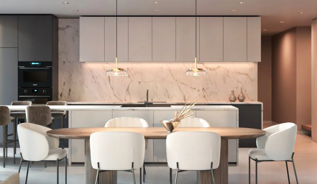 A sleek modern kitchen featuring elegant white marble countertops and contemporary cabinetry.
