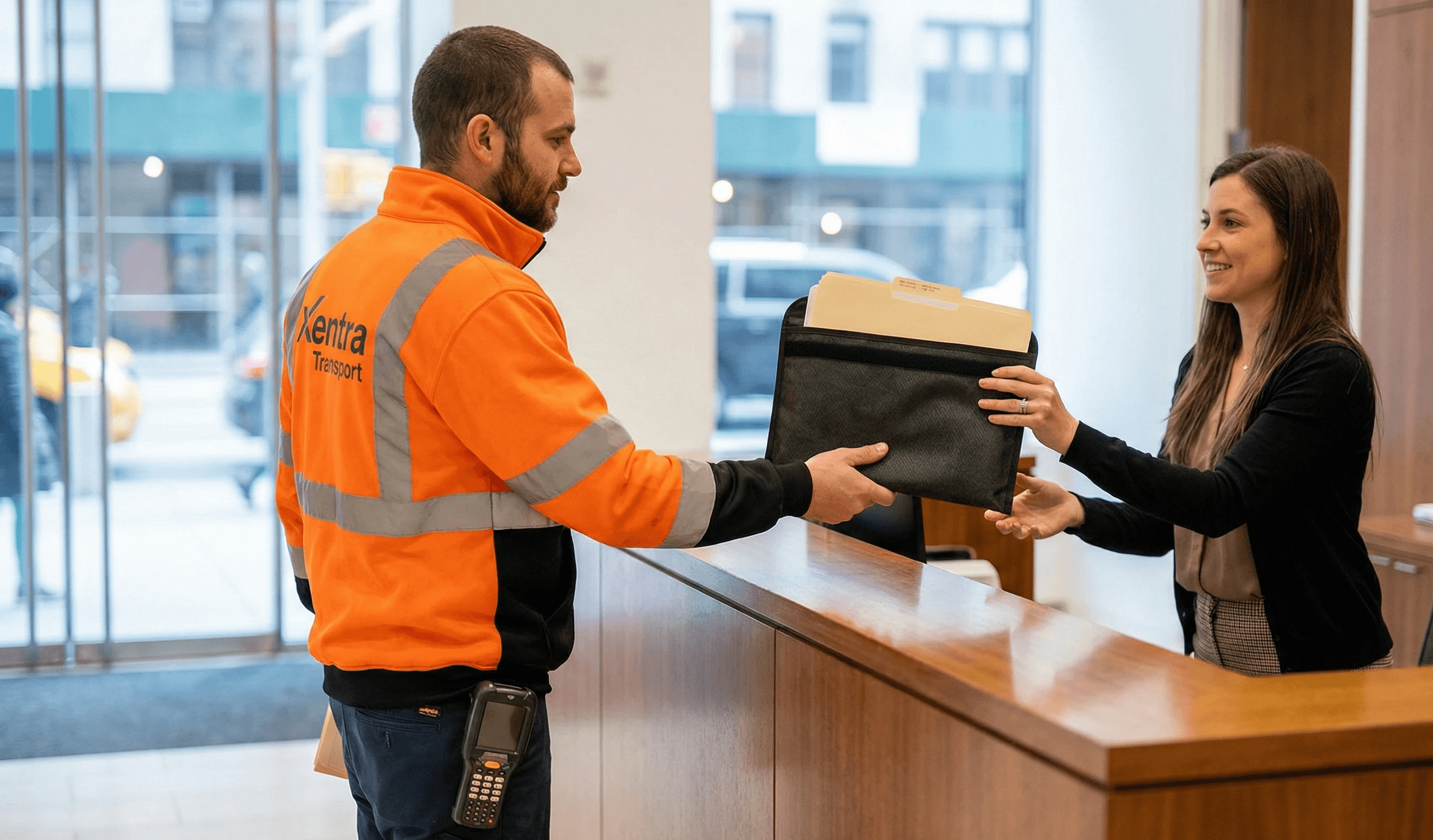 delivers a thick secure document pouch and claim file folders to a receptionist in nyc