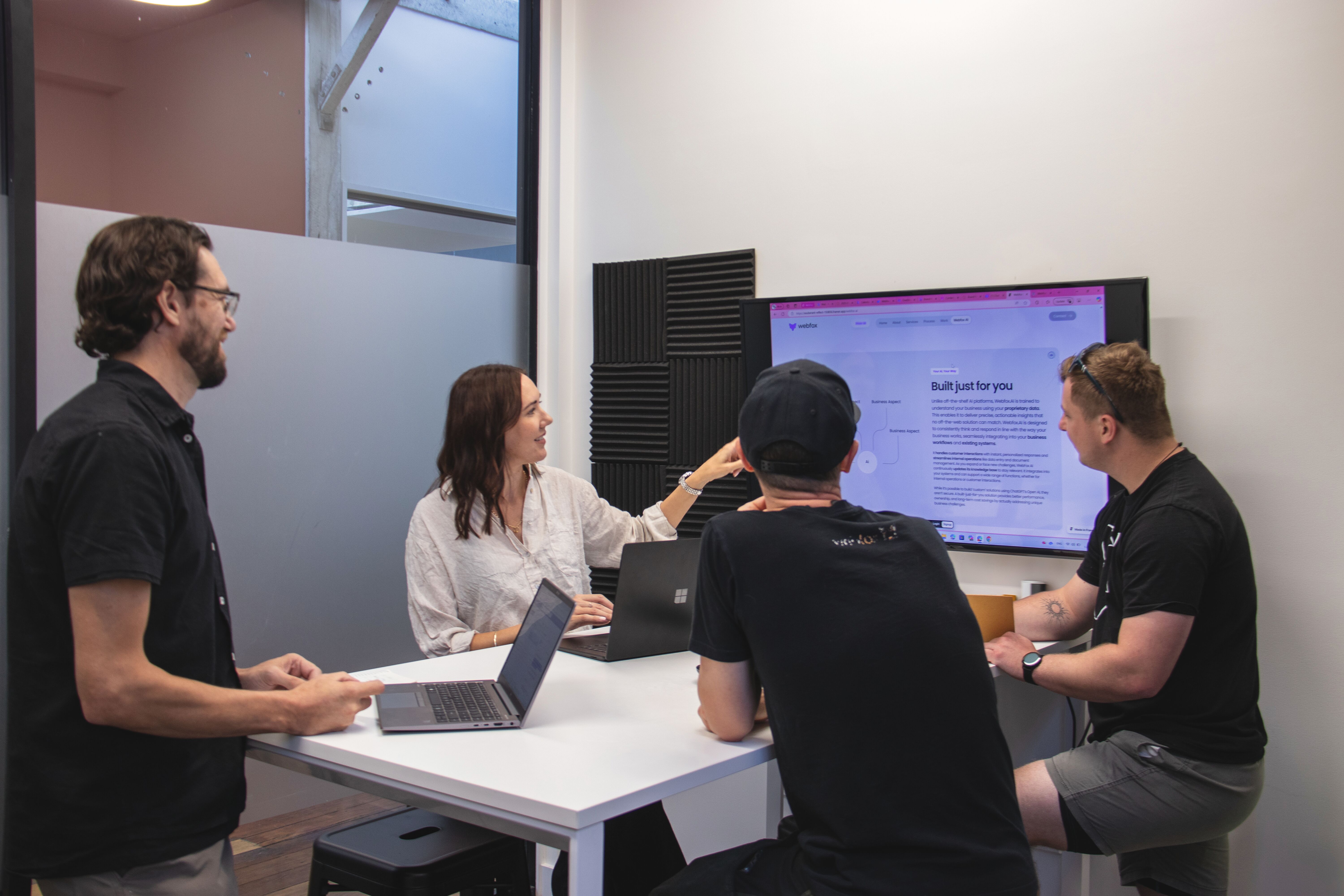 Webfox team members collaborating during a meeting in their Napier office – discussing AI and digital strategy.