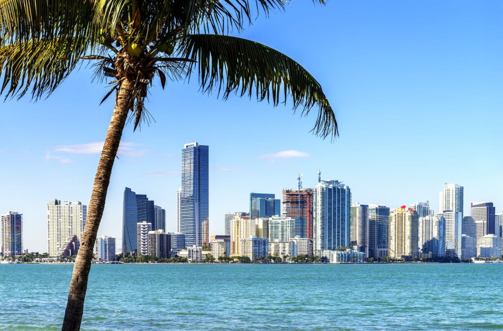 A group of people praticing yoga on the beach in the morning