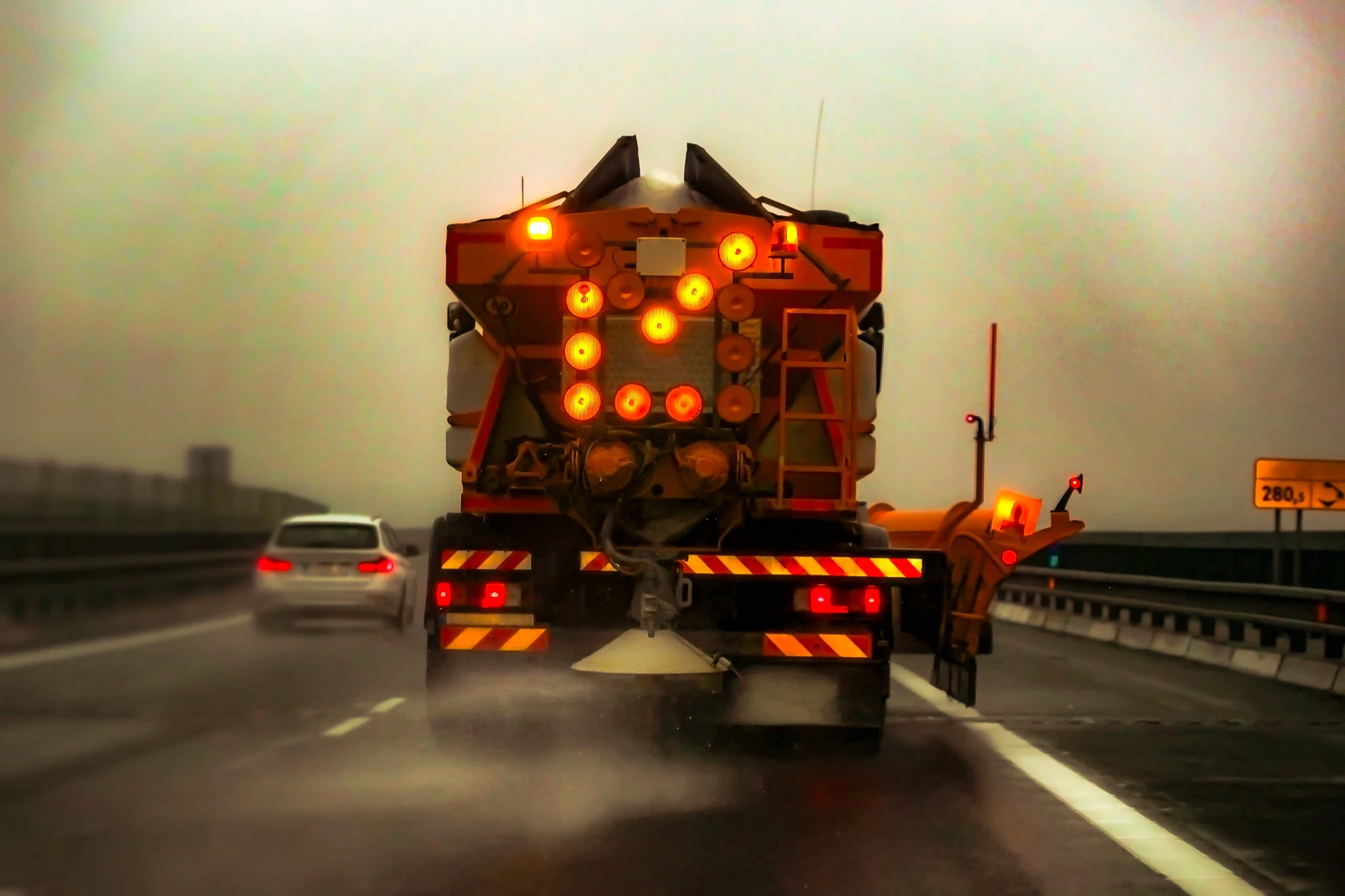 Salting truck spreading salt on road