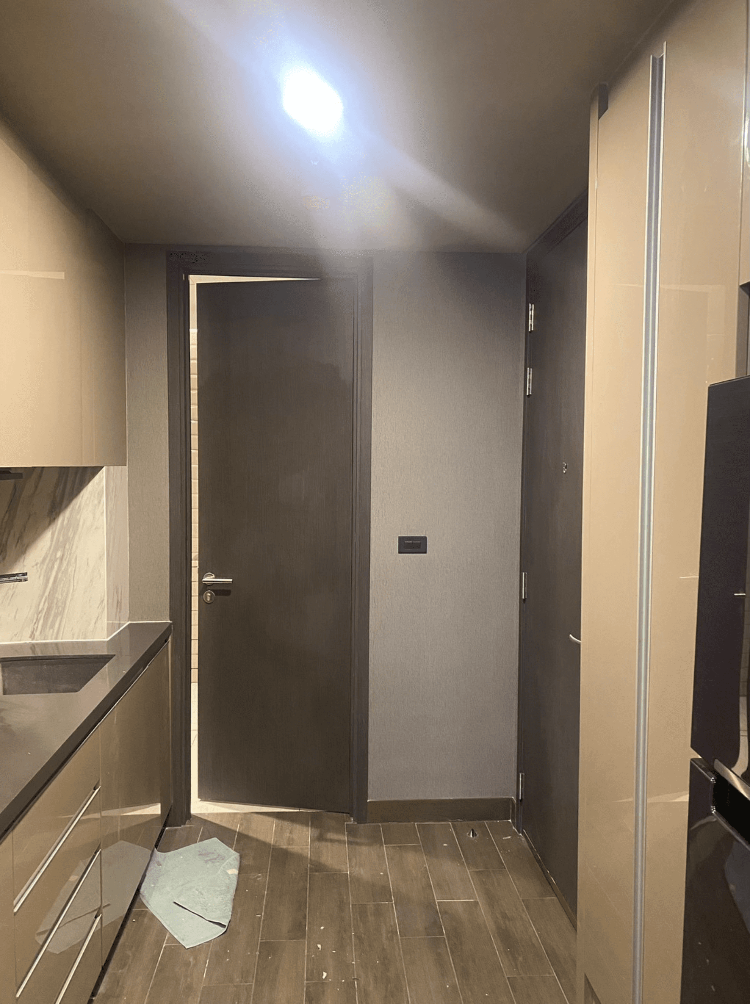 Luxurious spa-like bedroom suite with freestanding white bathtub, floor-to-ceiling windows with garden views, yoga mat, neutral bedding, and serene lighting
