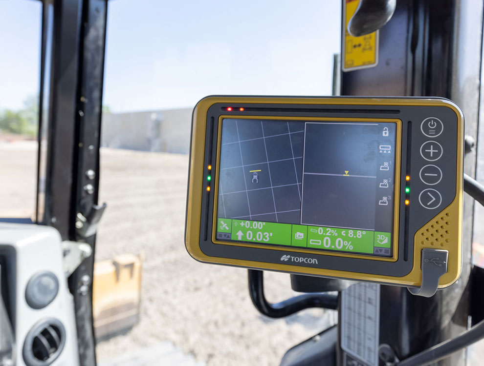 GPS machine control system used for precision grading and compaction during roadway prep
