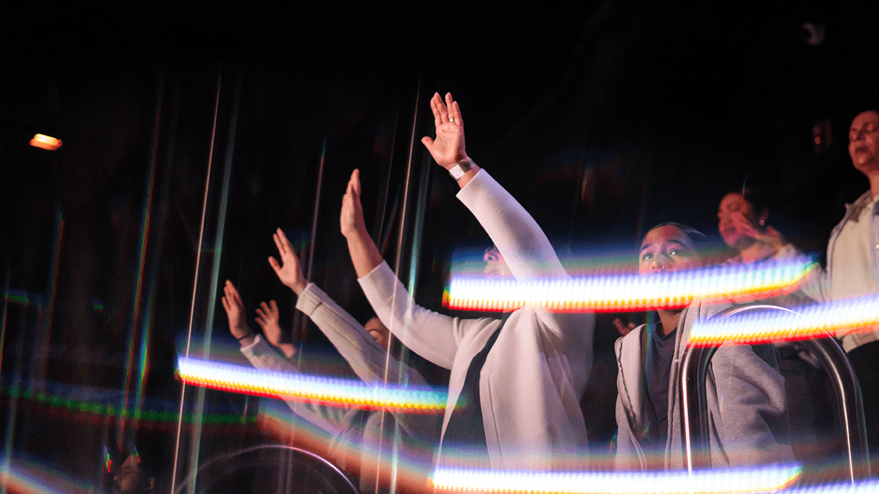 Red door with glass panes on brick building