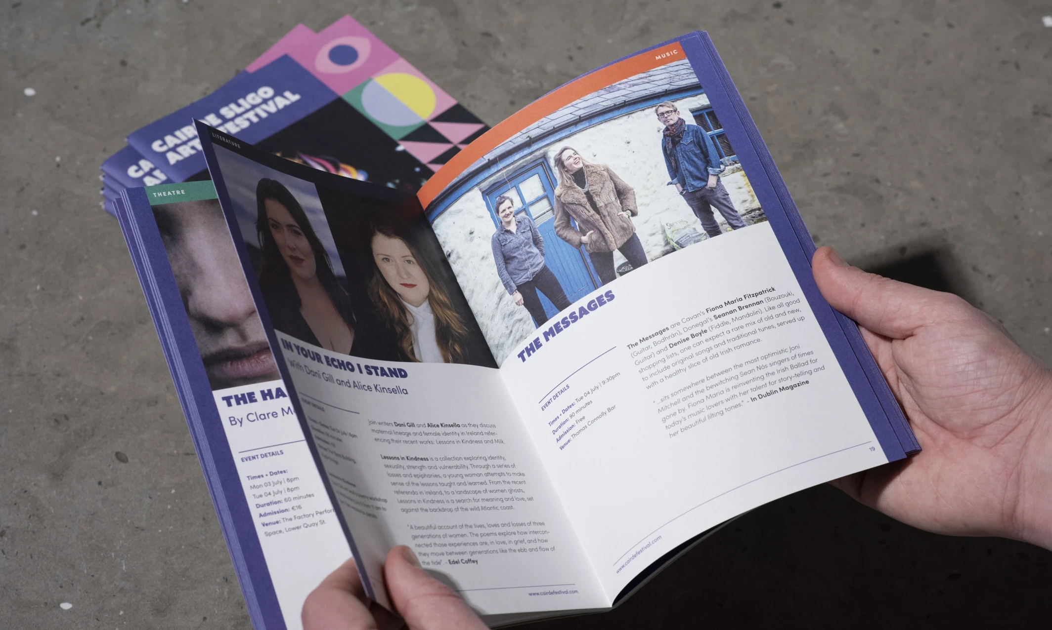 Man flipping through a festival brochure