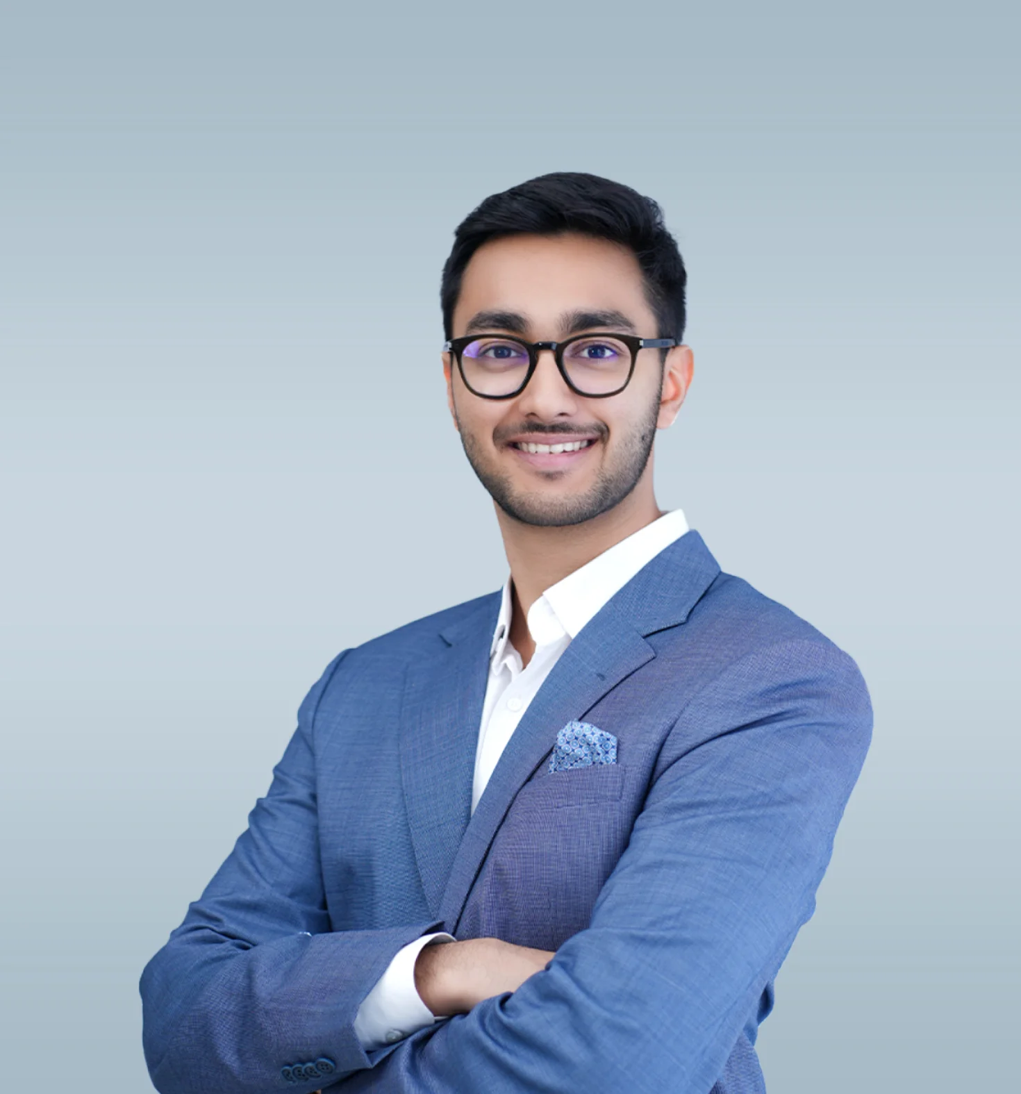 a man in a blue suit posing for a picture