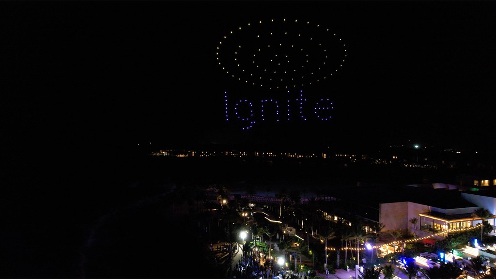 Photo of drones in the shape of the word "Ignite."