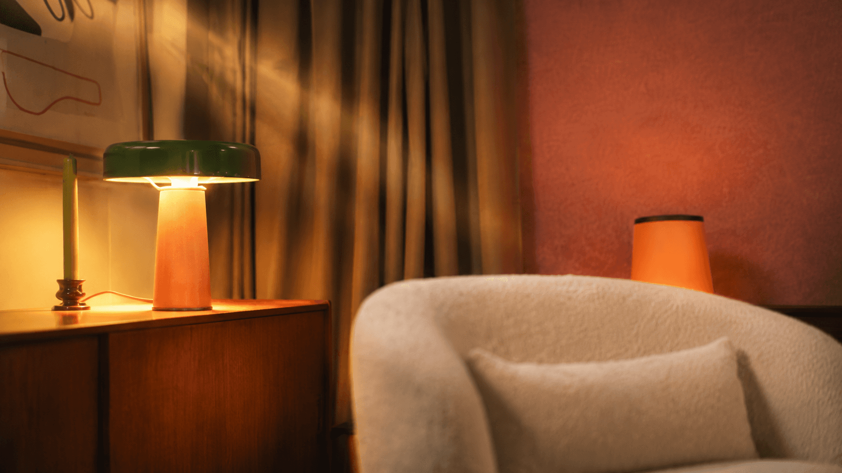 Terracotta wall interior with wooden architectural elements and dramatic natural light.