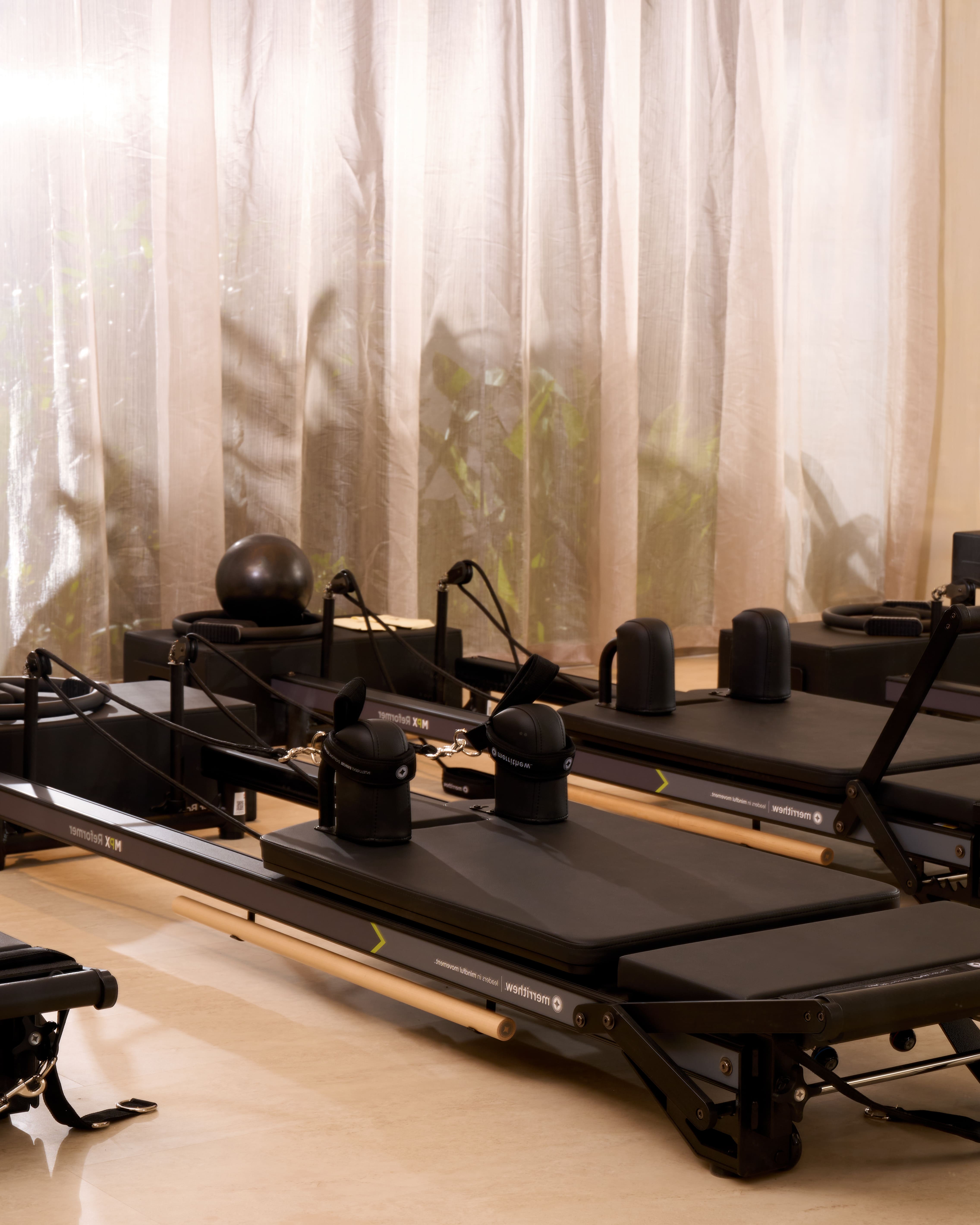 a woman is doing a piyoma exercise in a gym