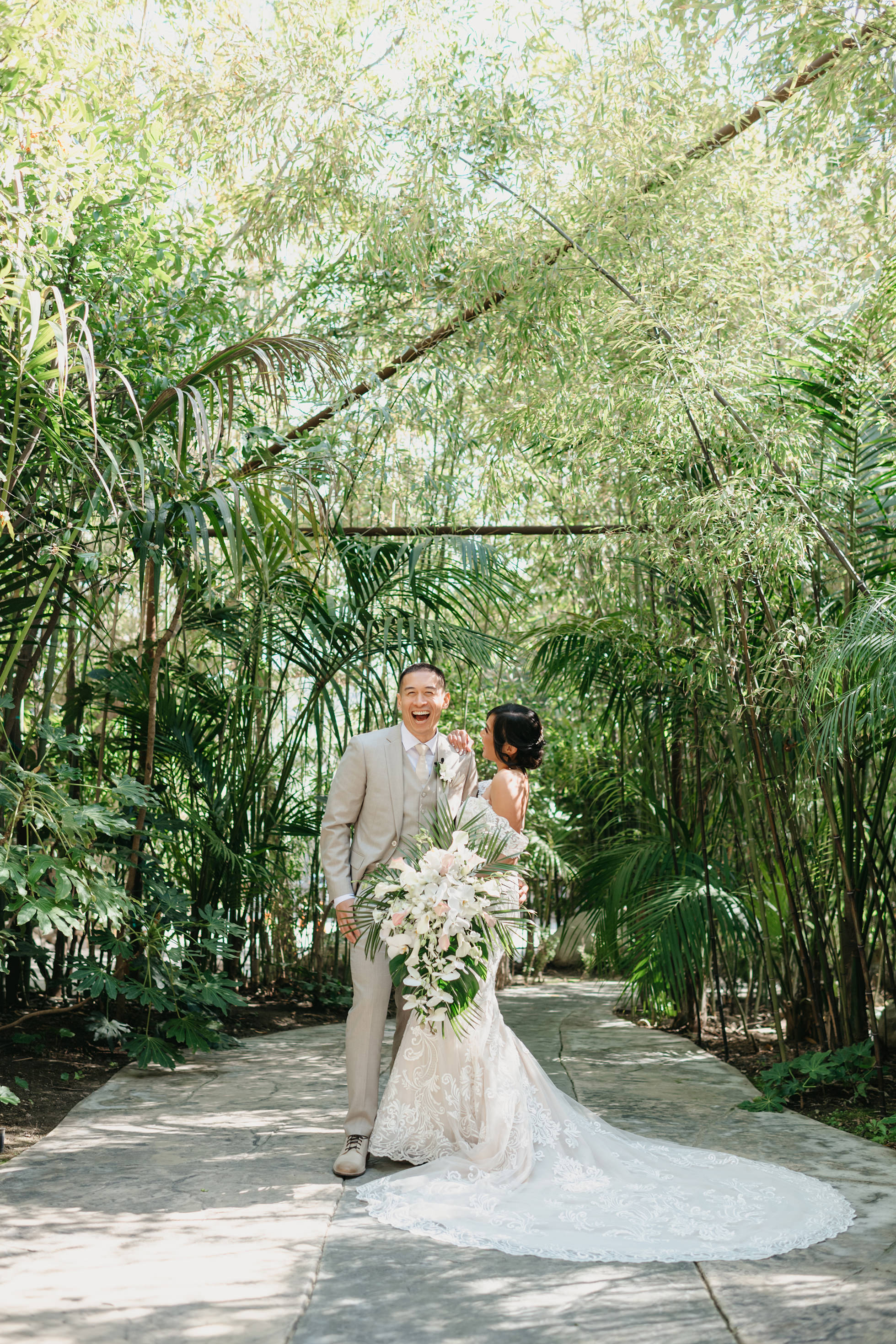 Romantic bride and groom portraits in lush greenery at Hartley Botanica