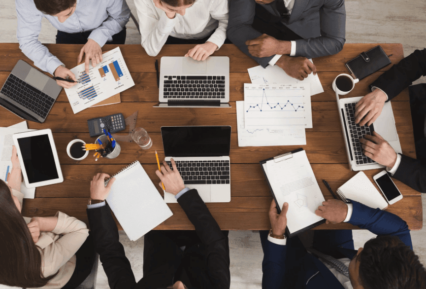 Small business financial professionals working on computers in a Texas office supported by BM Bookkeeping