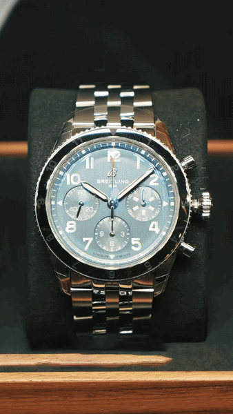 Close-up of bride and groom's torsos, bride in white dress