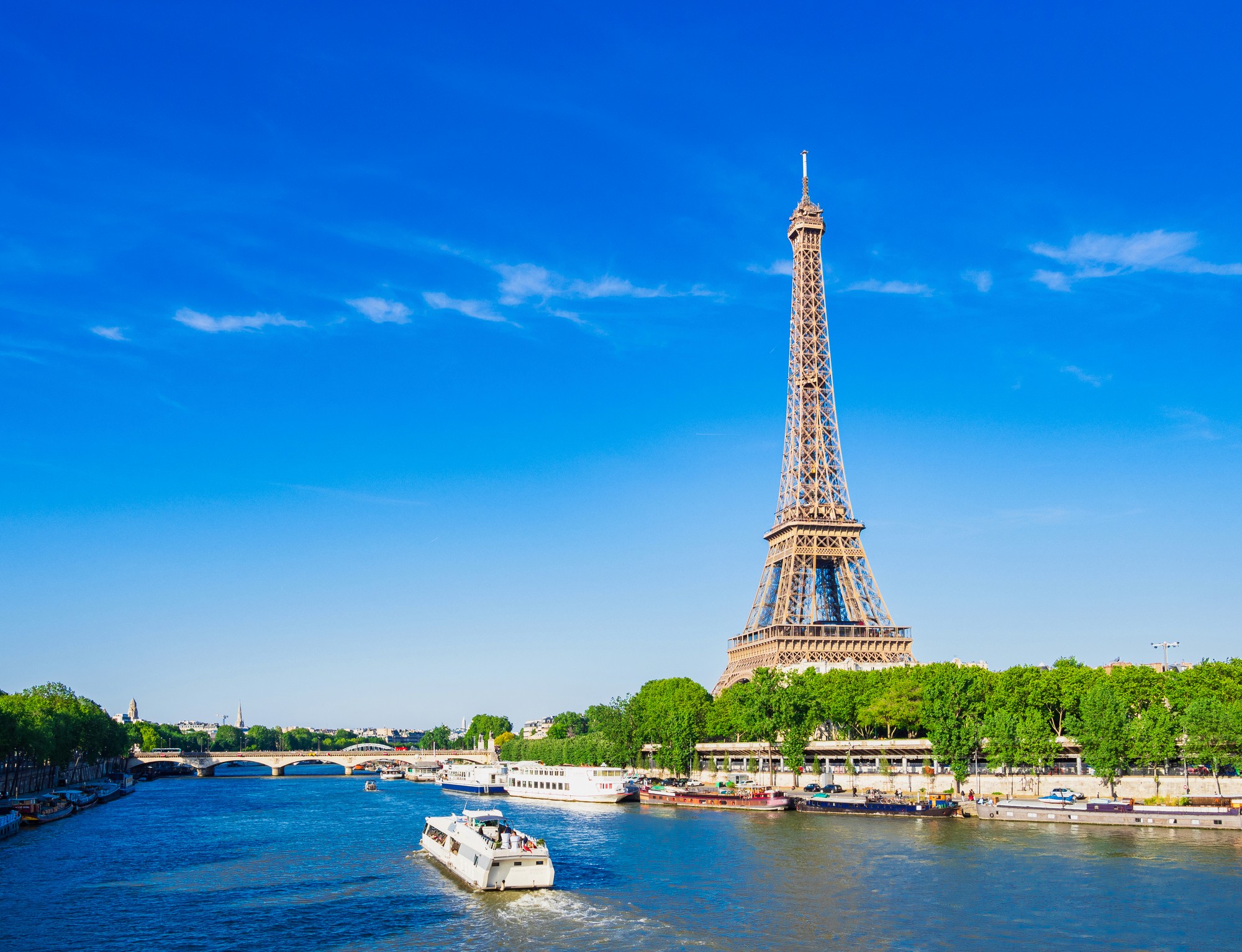 black car parked near white concrete building during daytime