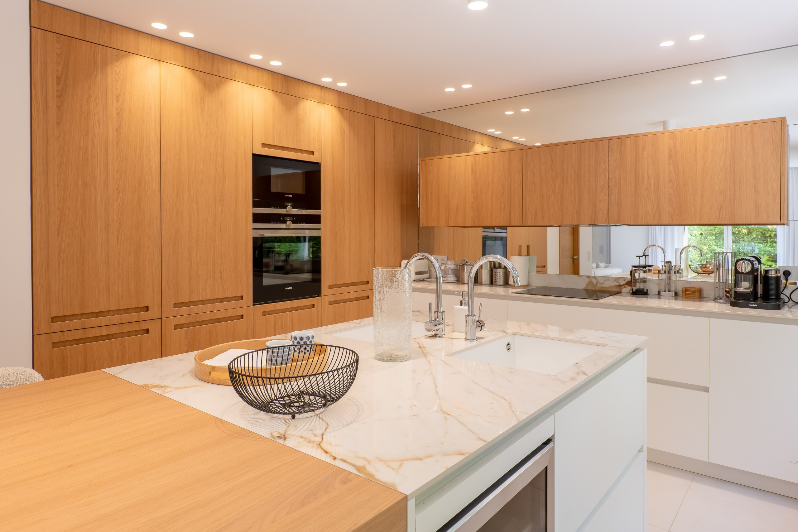 Modern kitchen island with bar chairs