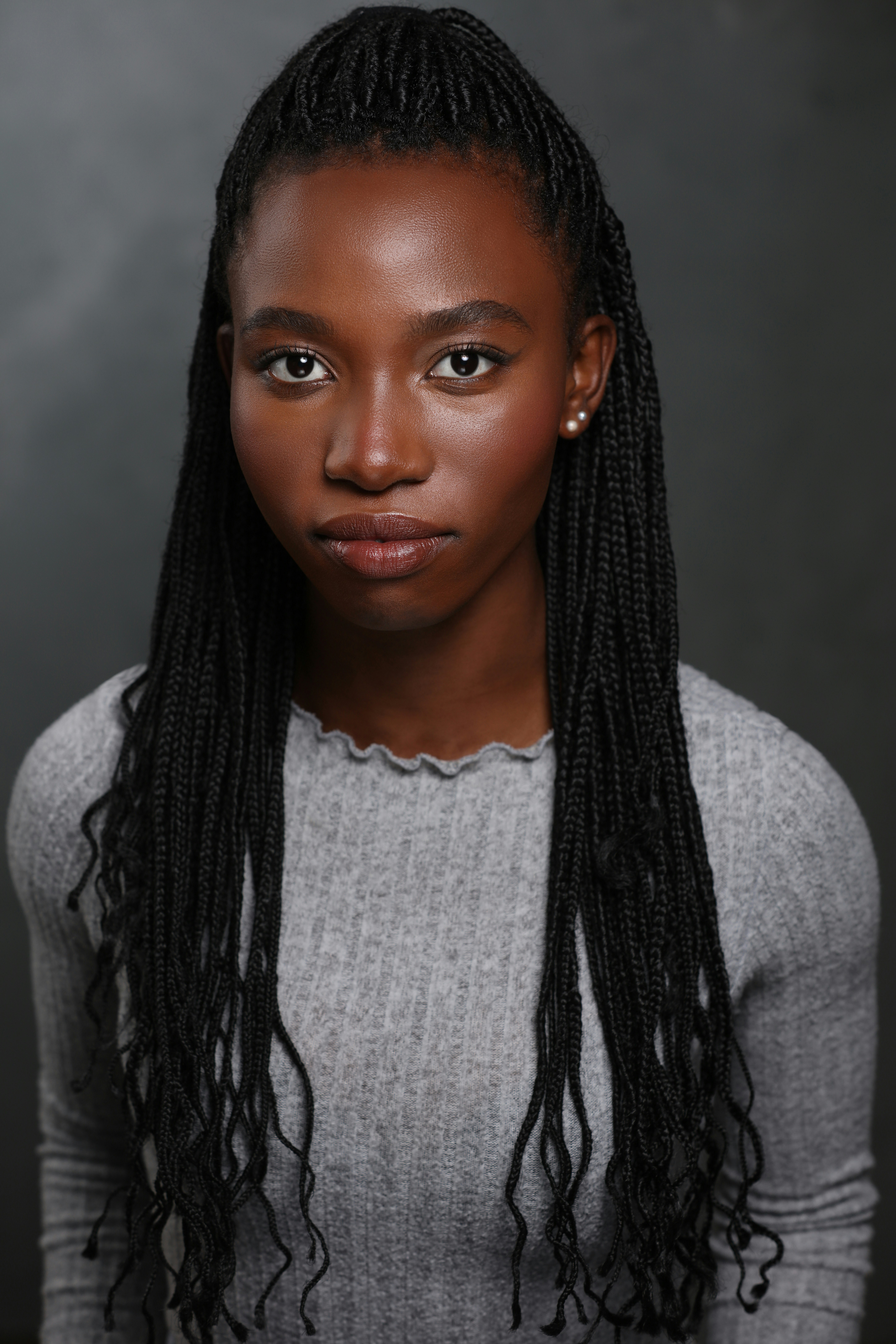 A young black woman with braided hair