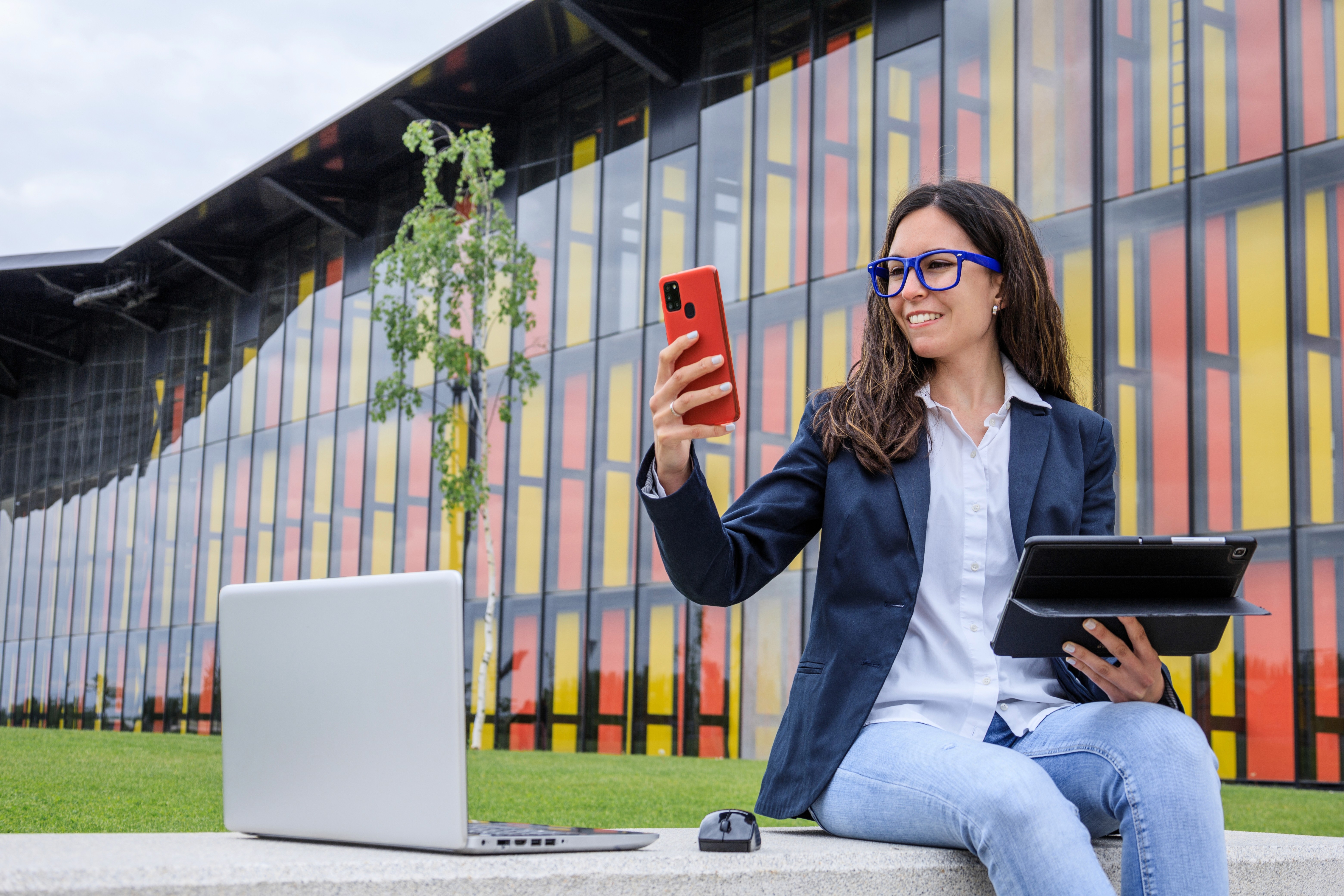 Person Holding a Phone an a Tablet