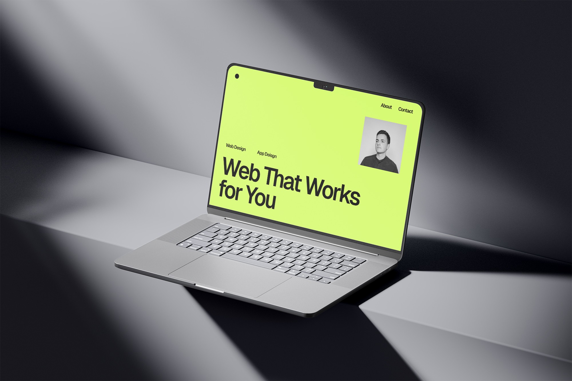 Laptop on concrete, website on screen