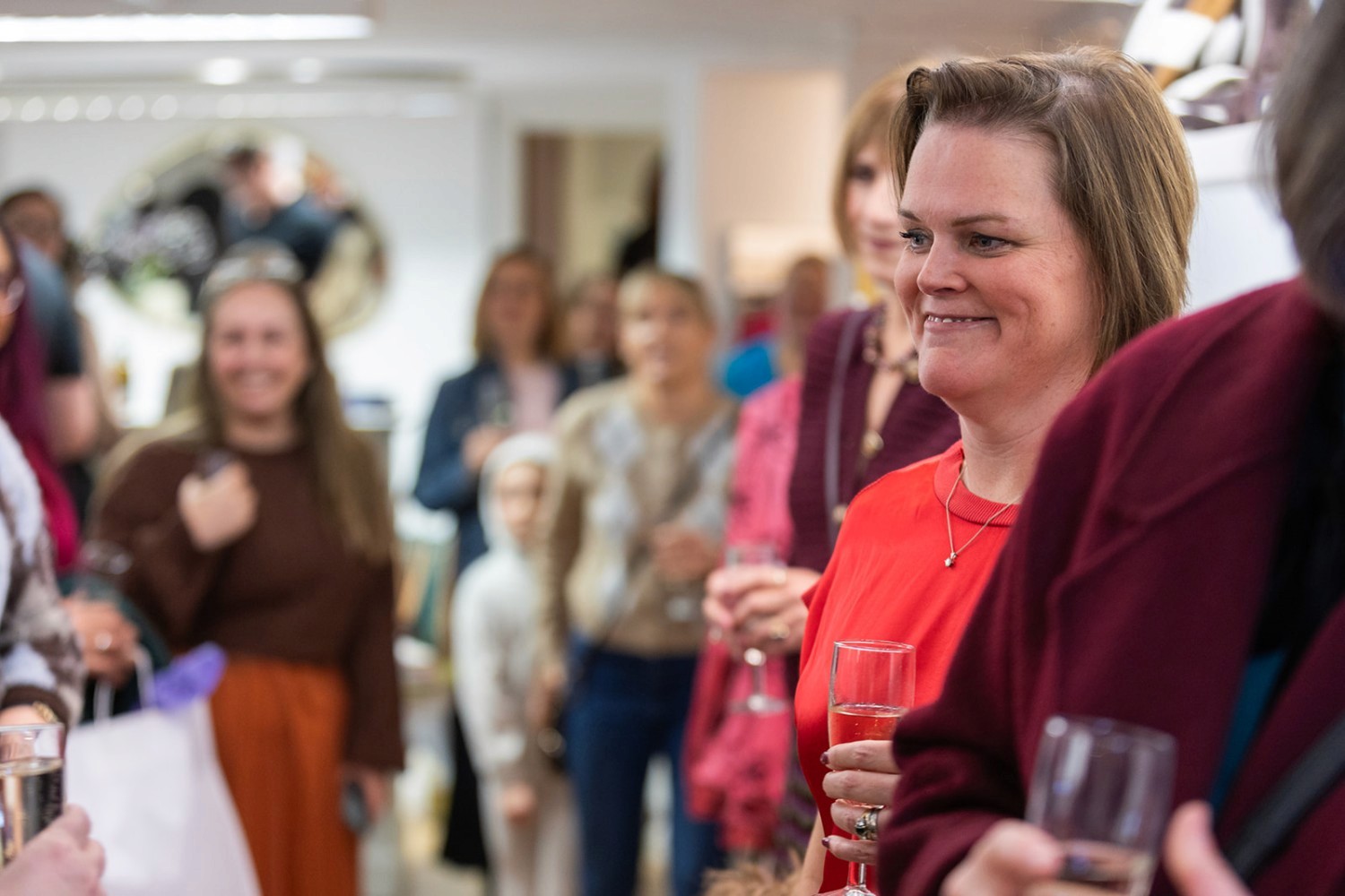 Woman jumping in vast white desert landscape