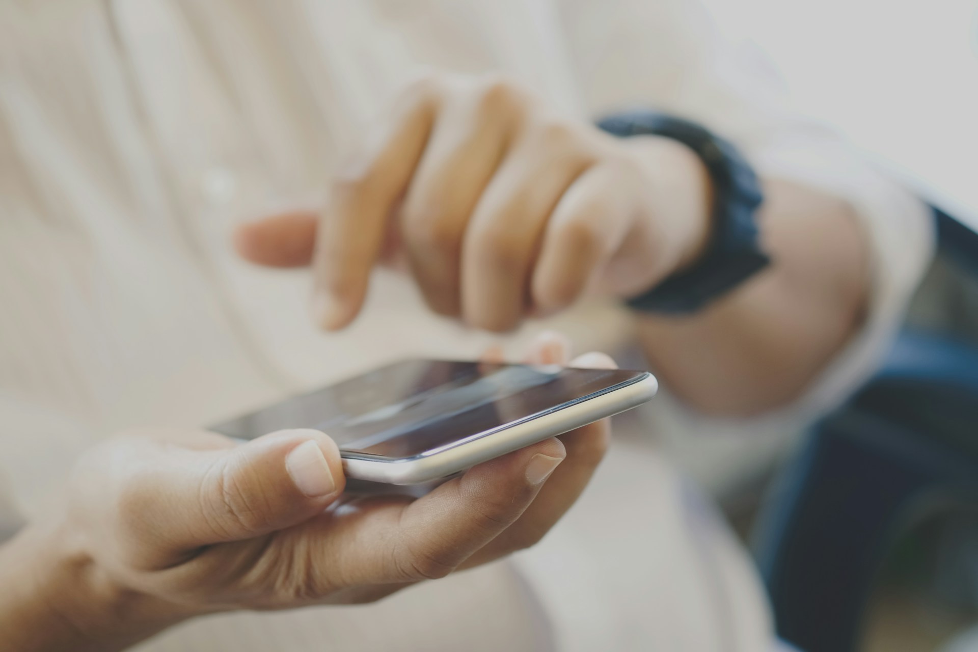 Close up of a man using his phone