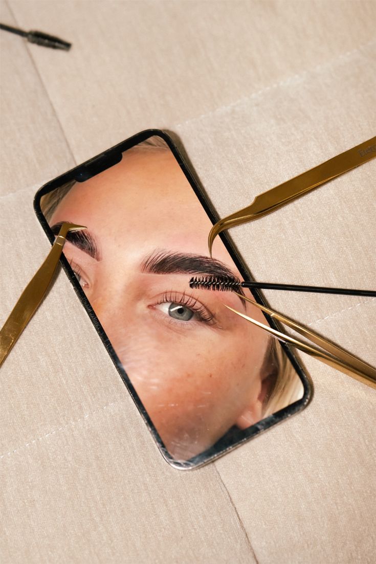 A wooden essential oil diffuser releasing a gentle stream of steam, surrounded by dried herbs and a small bottle of essential oil. The warm lighting enhances the cozy and therapeutic ambiance.