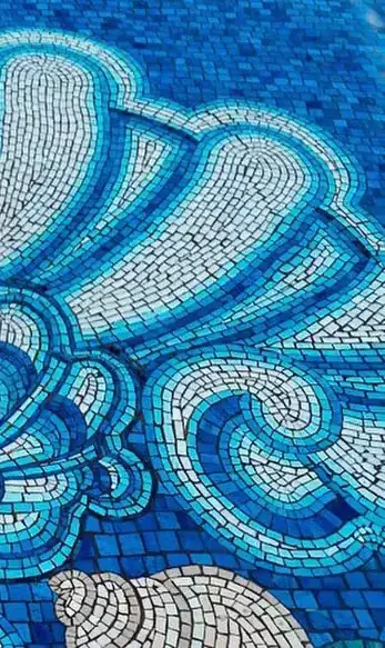 Custom Italian mosaic pool with intricate blue and white patterns in Paradise Valley, Arizona.
