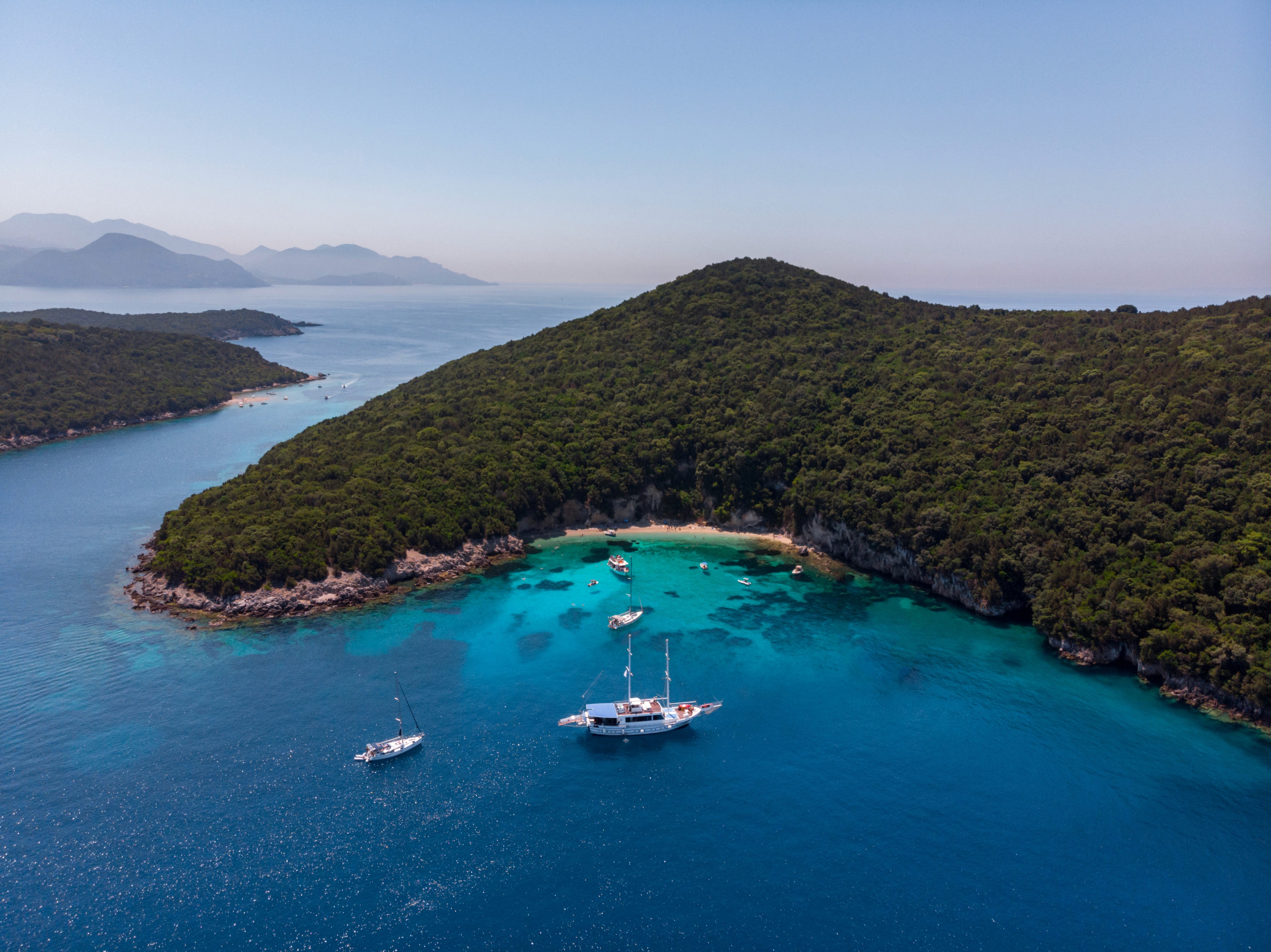 Majestic sandstone cliffs in golden light, showing the natural beauty of AlUla’s desert landscape.