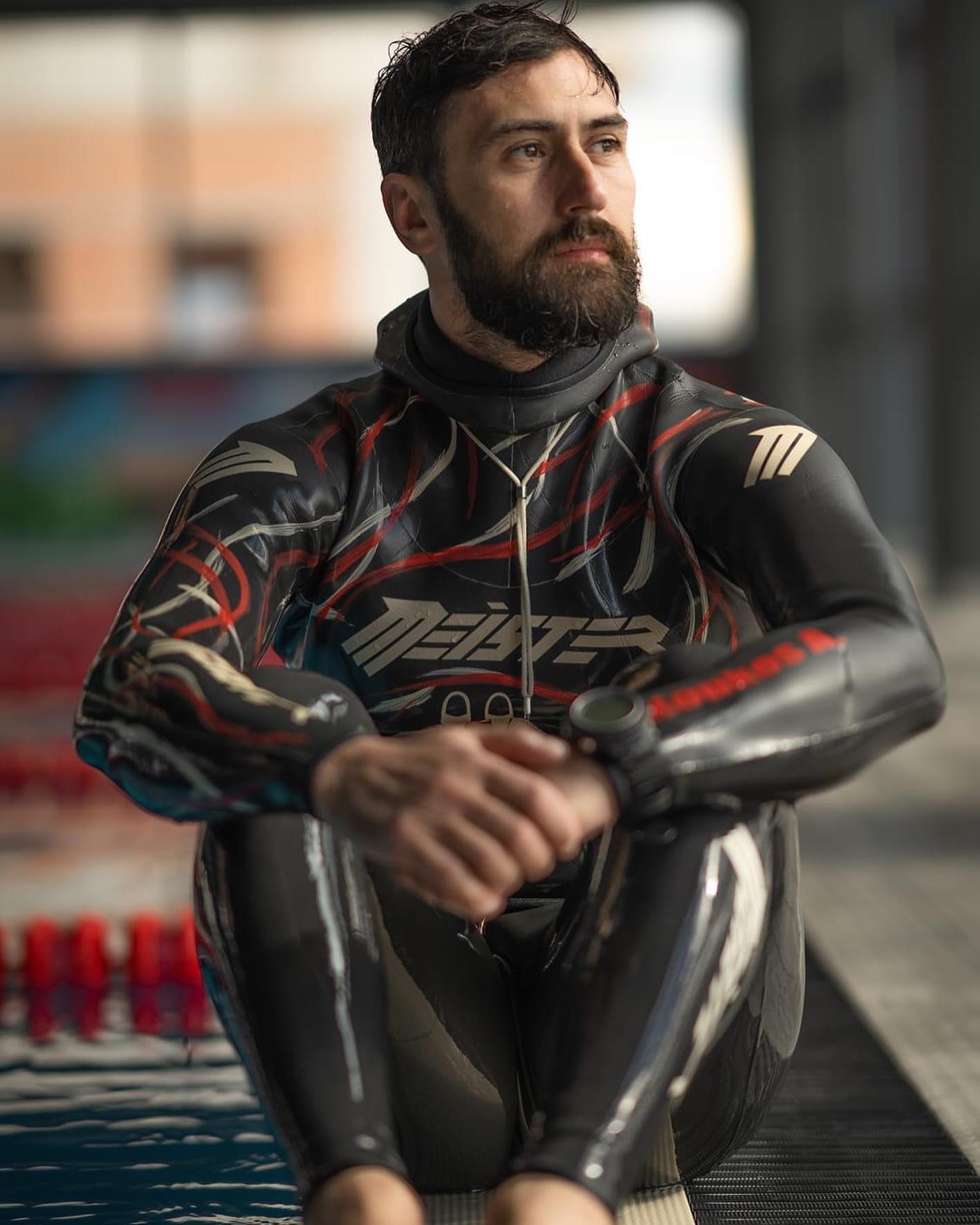 meister man athlete sitting in front of a swimming pool