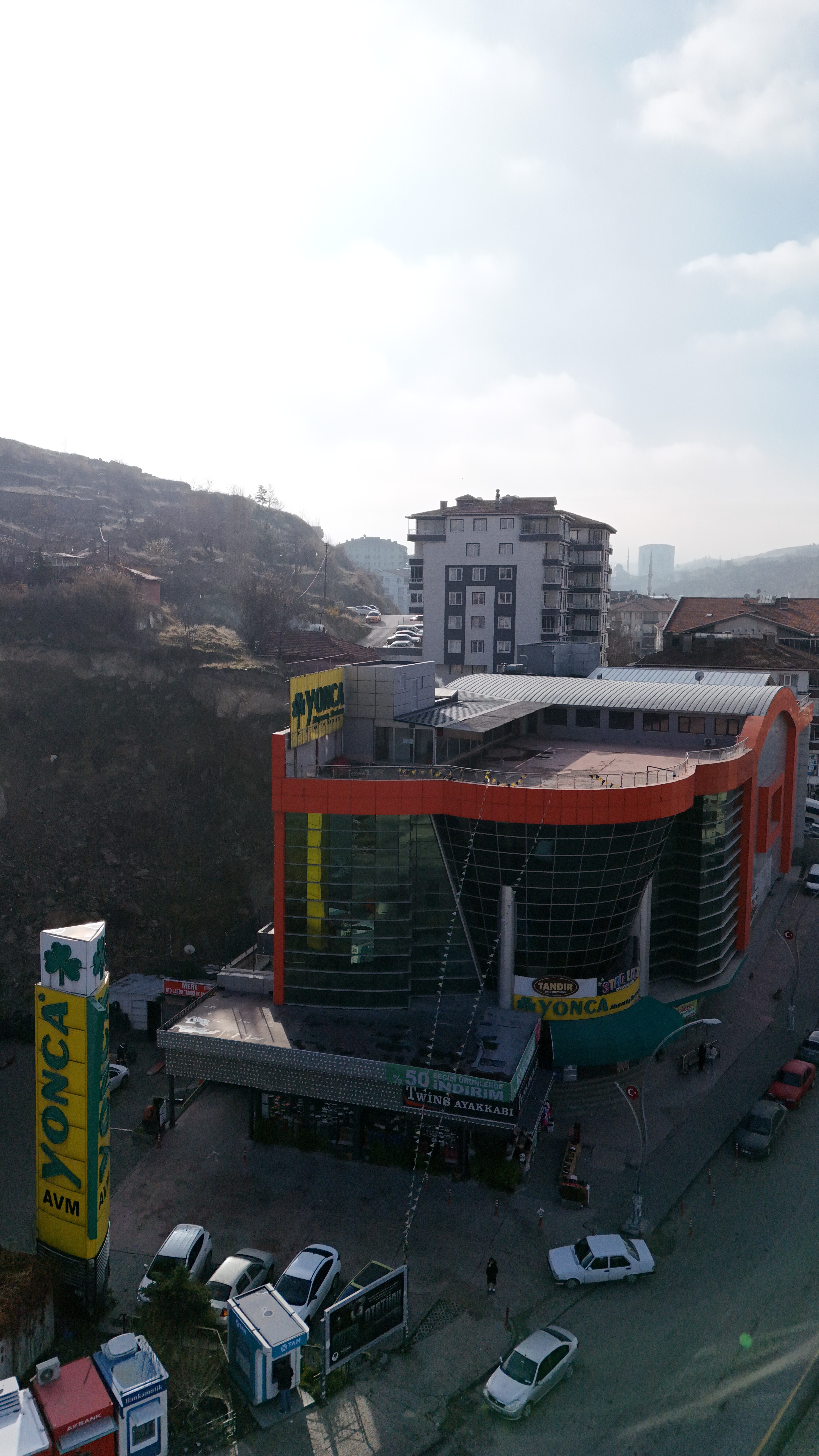 Wide interior view of a modern shopping center with open spaces and organized retail areas.