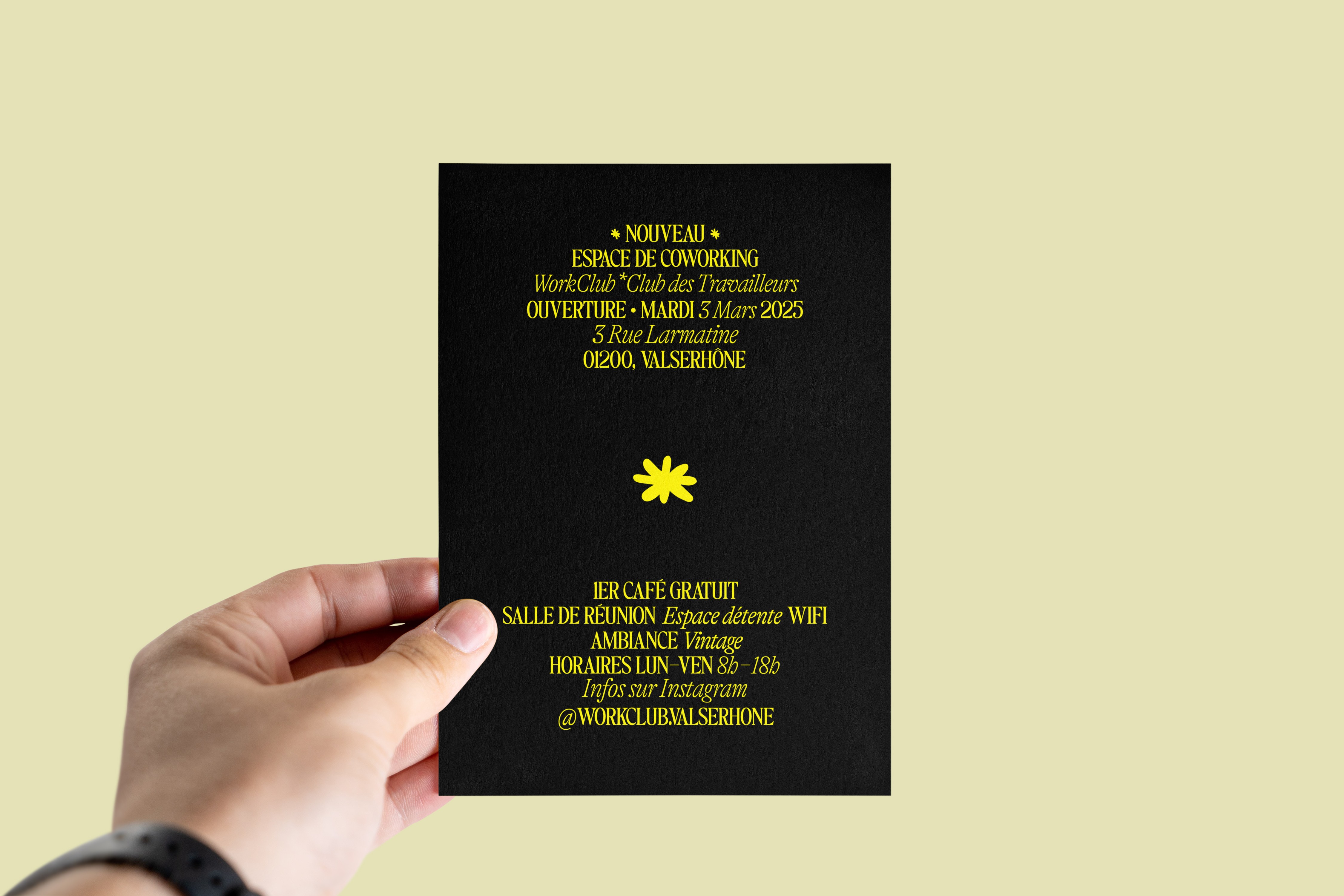 Close-up of a yellow tennis ball sitting on a green court, positioned near the white center line.