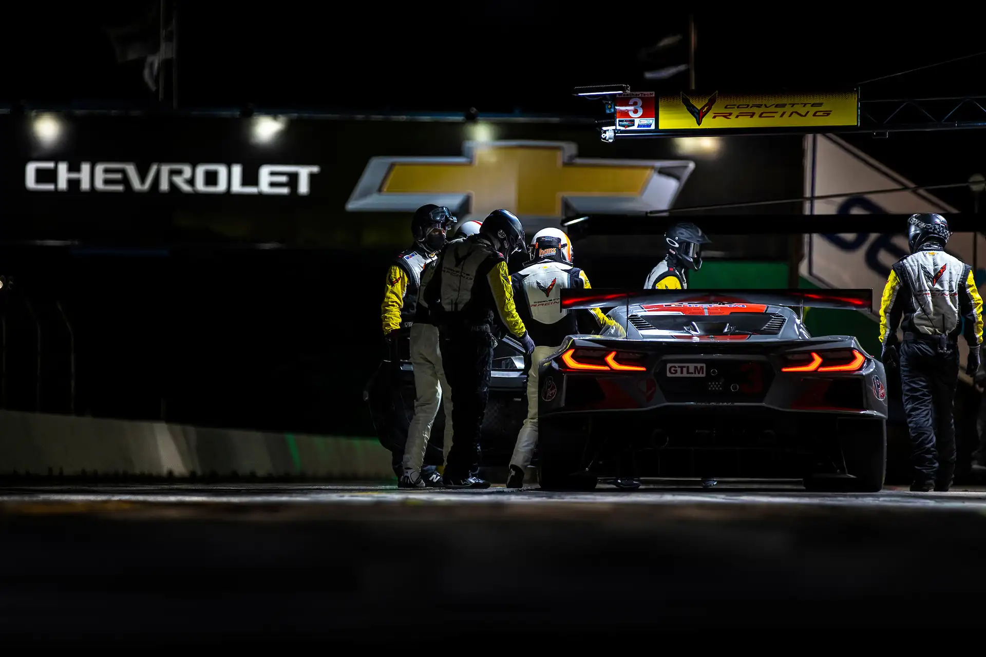  A driver getting into his car at night.