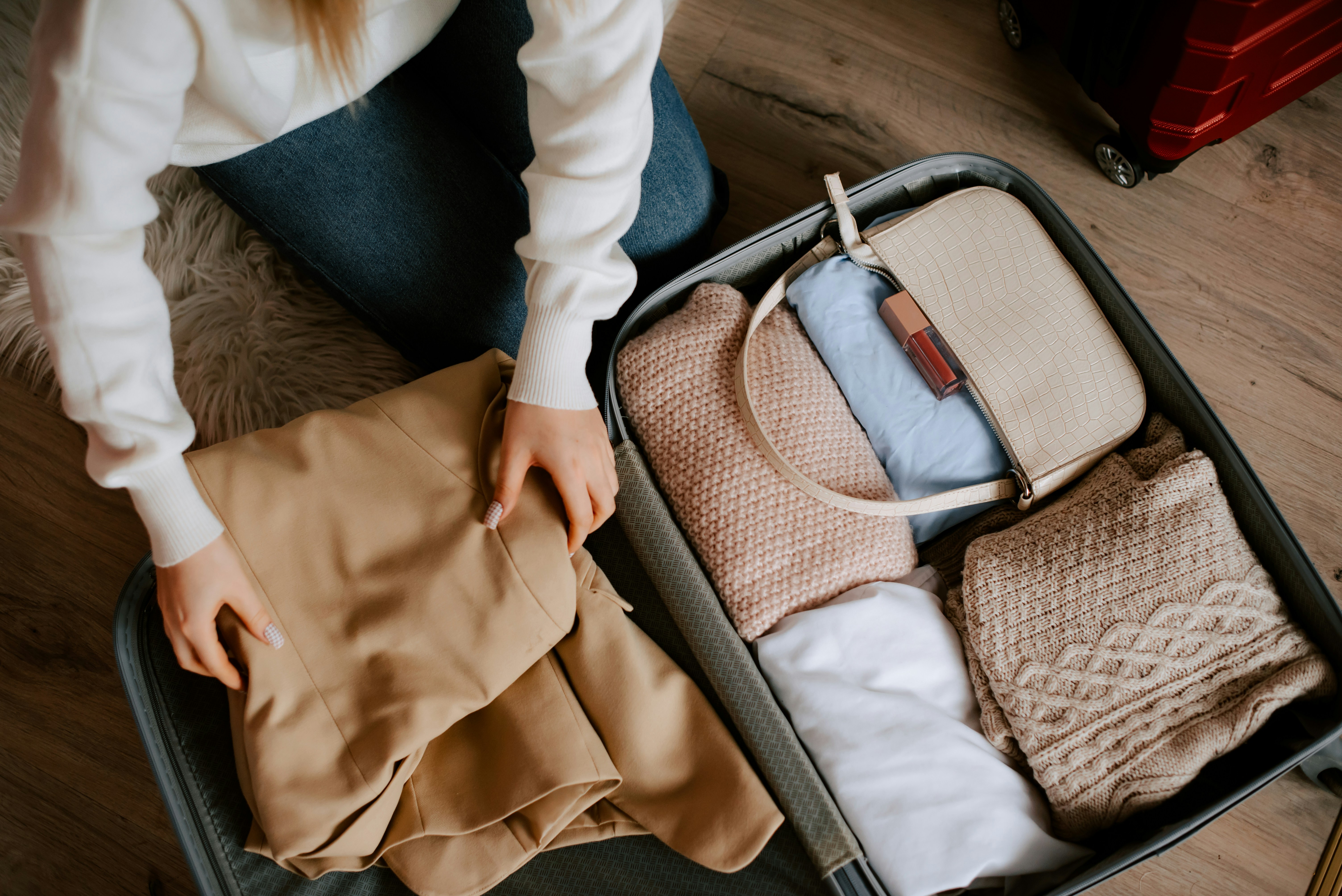 Woman organizing her travel bag.