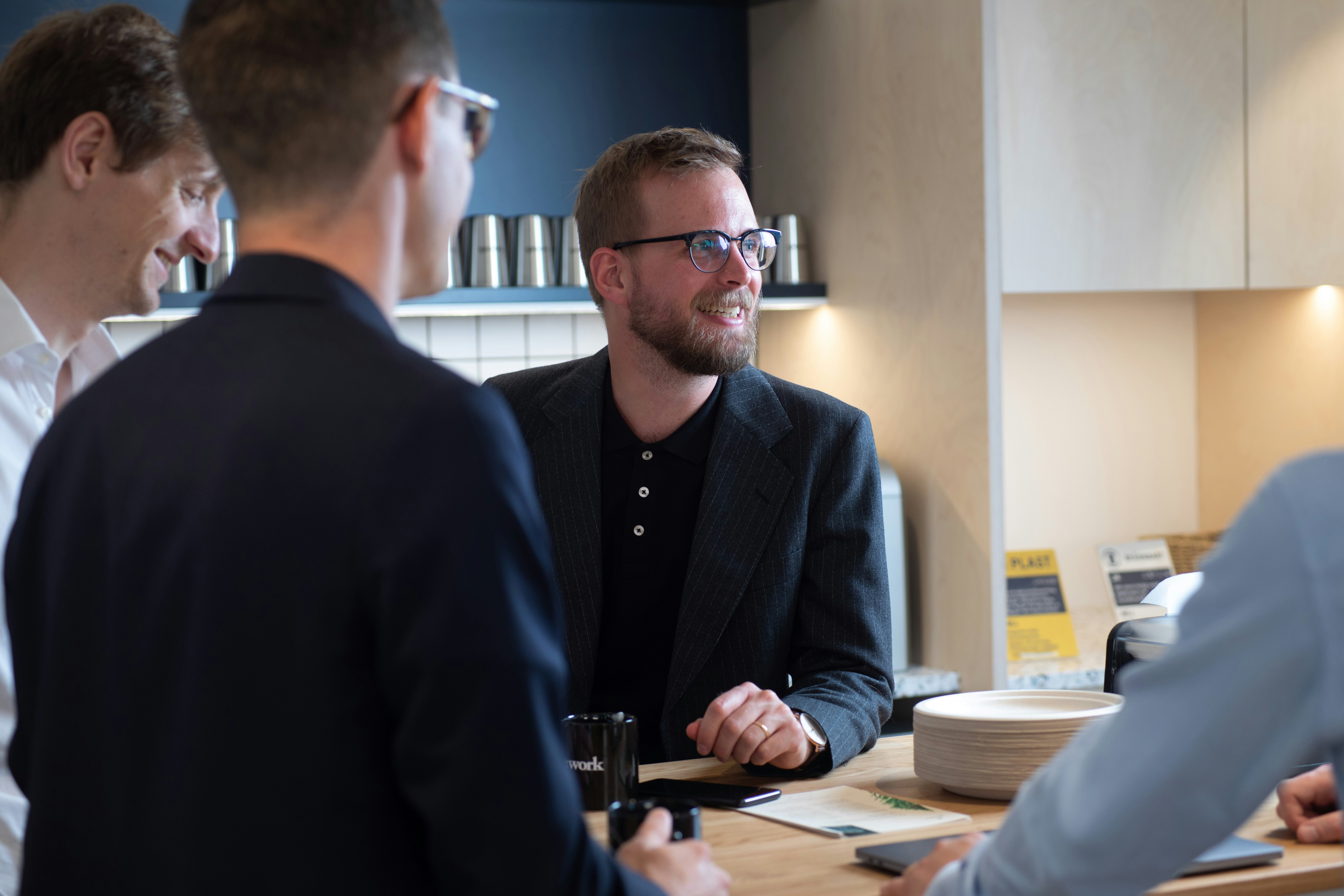 Rows of parmesan cheese wheels are neatly stacked.