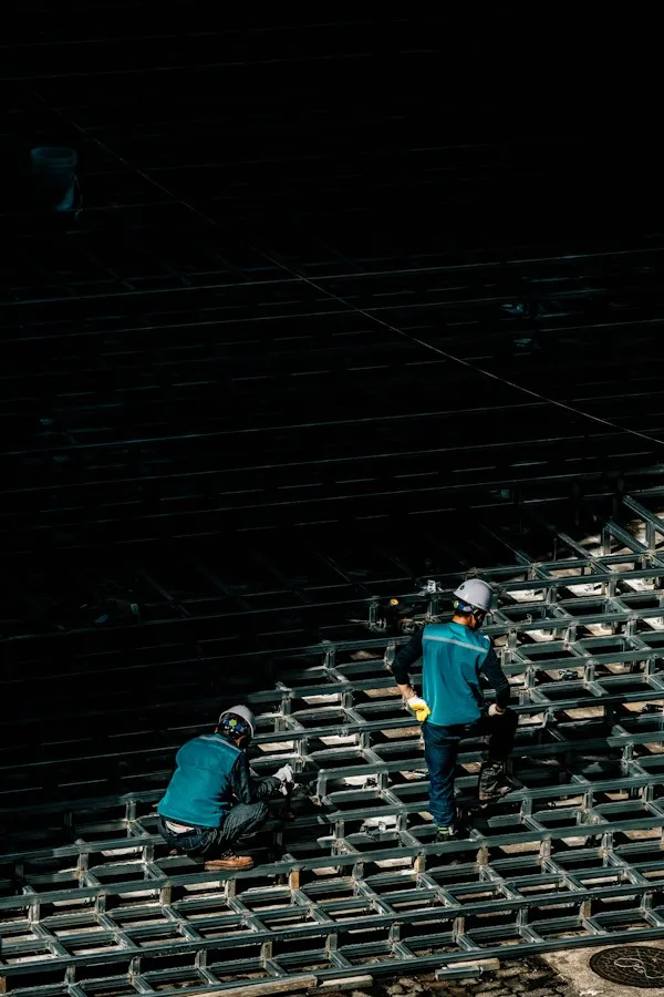Construction workers assembling a building structure