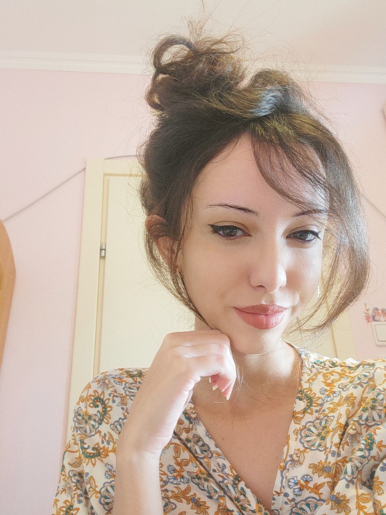 A young girl smiling