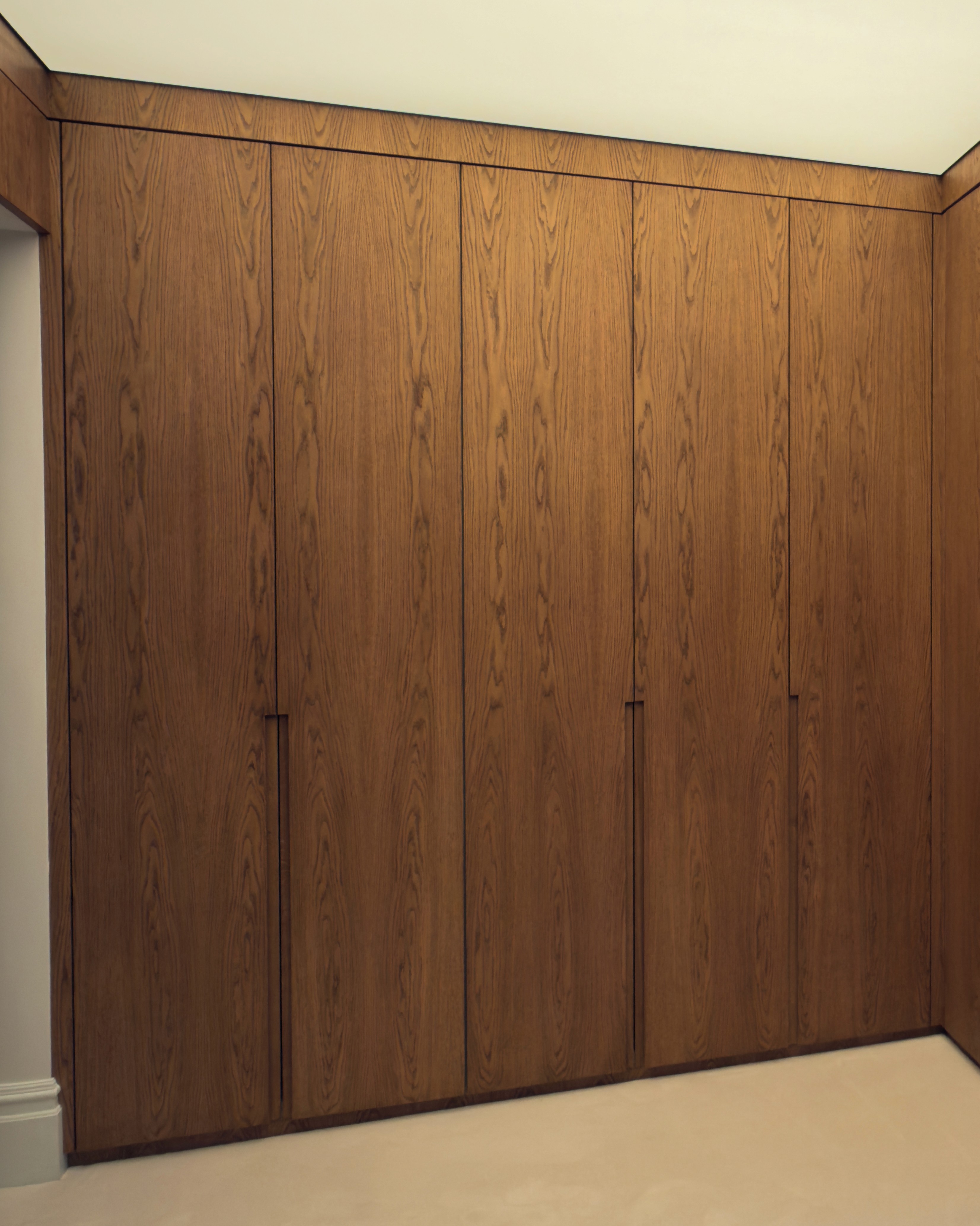 Full-height oak wardrobe doors with natural timber grain detail