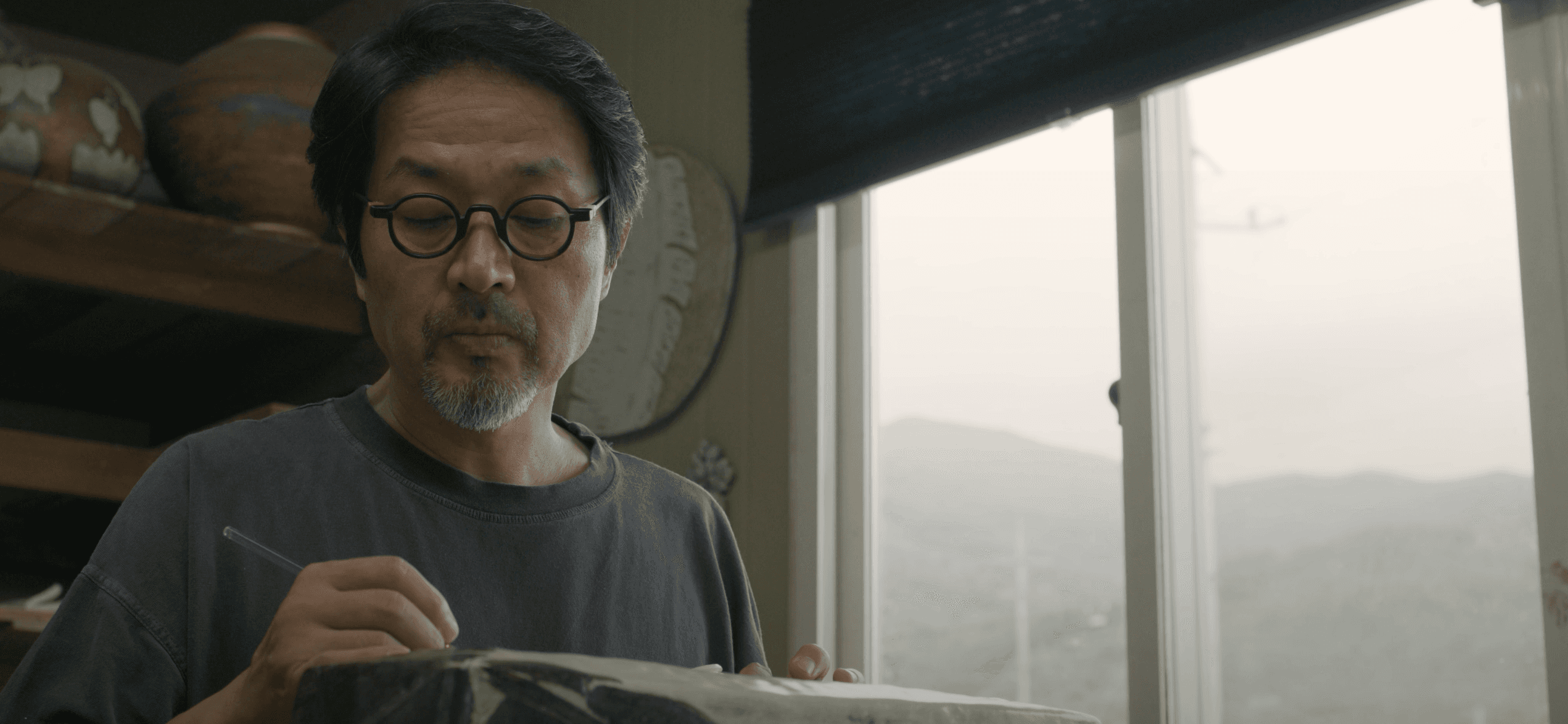 a purple ball of rope on a white background