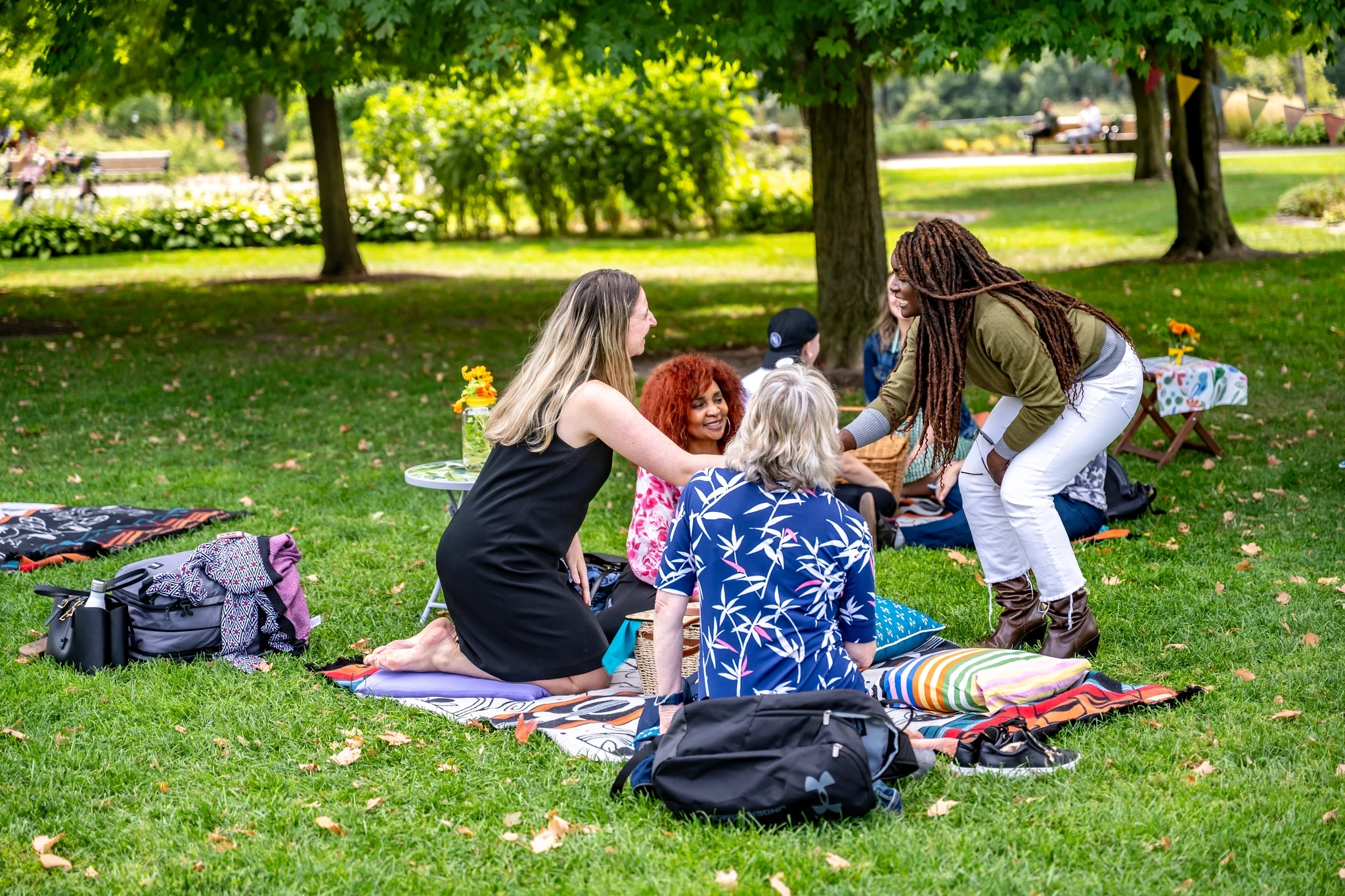 People relaxing together on the grass in a park