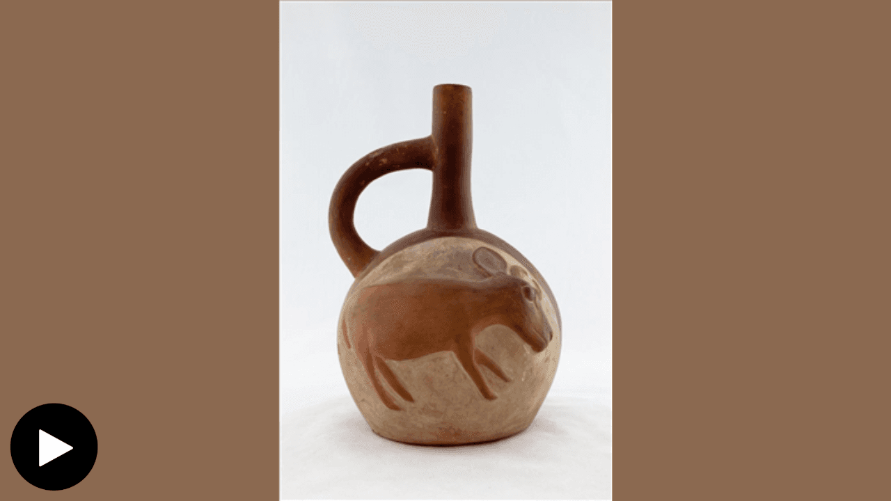 A photograph of a Moche vessel with a flat stylized deer molded onto the front.