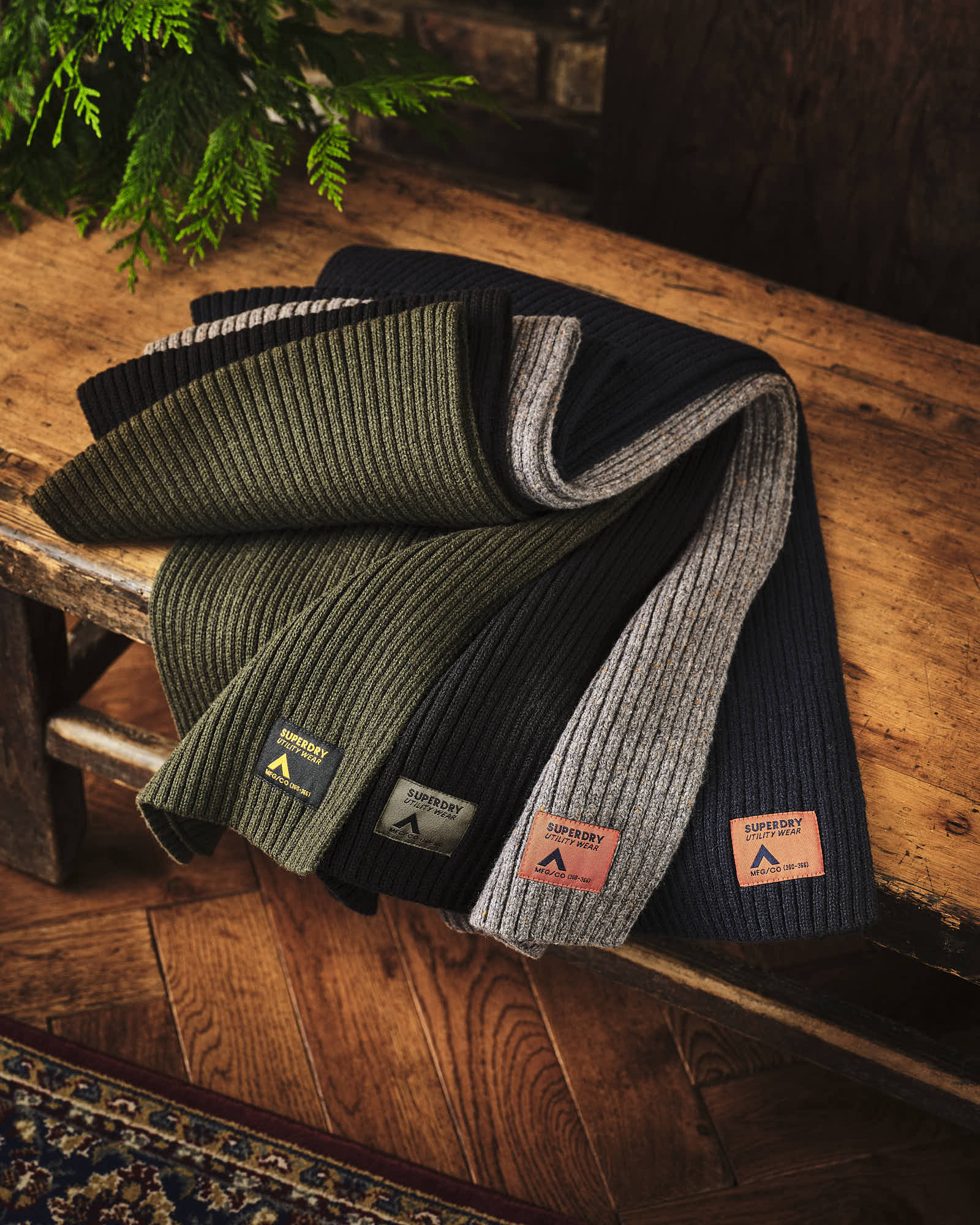 Colorful Superdry Ribbed Scarves on Rustic Wooden Bench