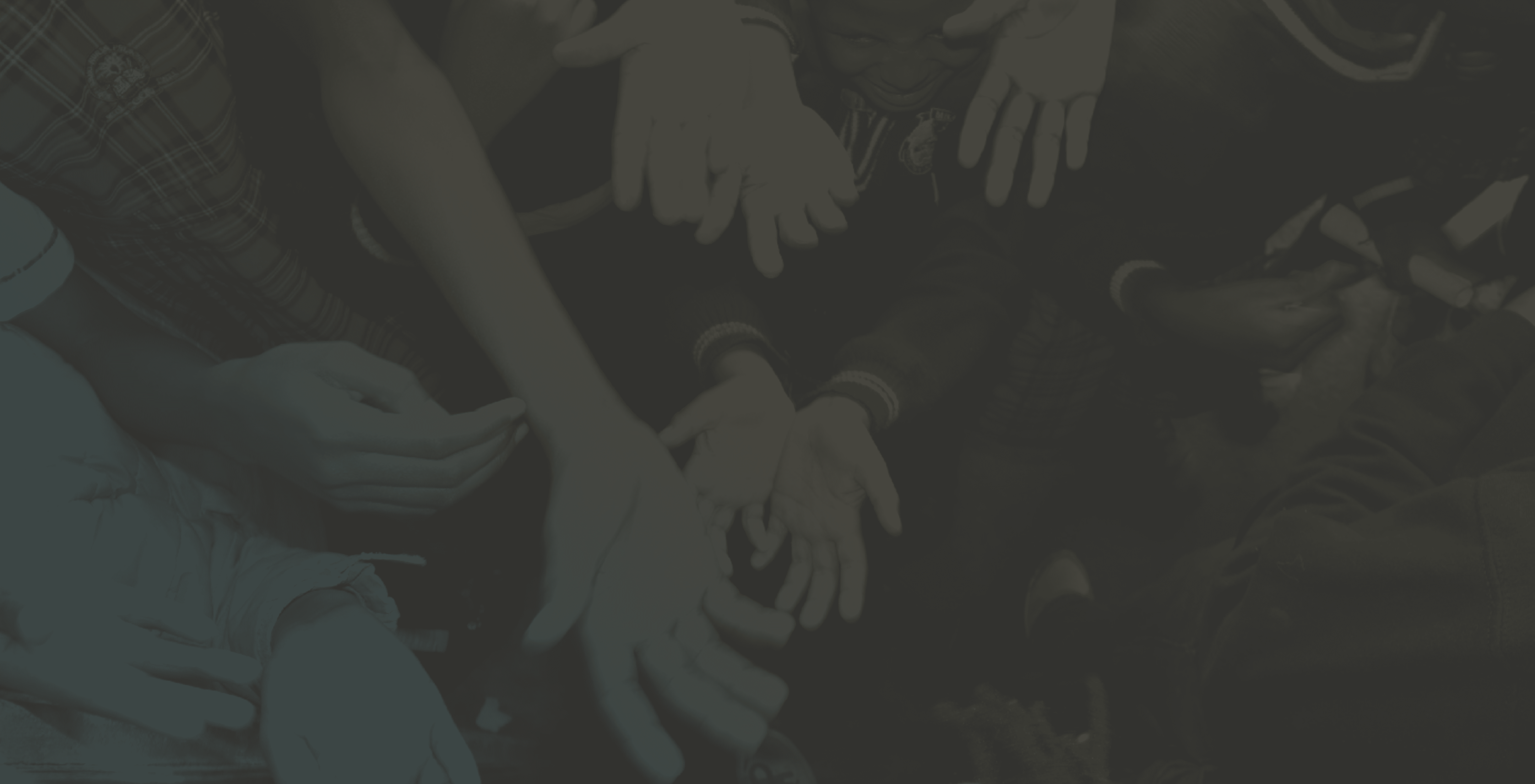 Outstretched hands of children, capturing the heart of nonprofit missions—responding to hunger, poverty, and the call to serve.