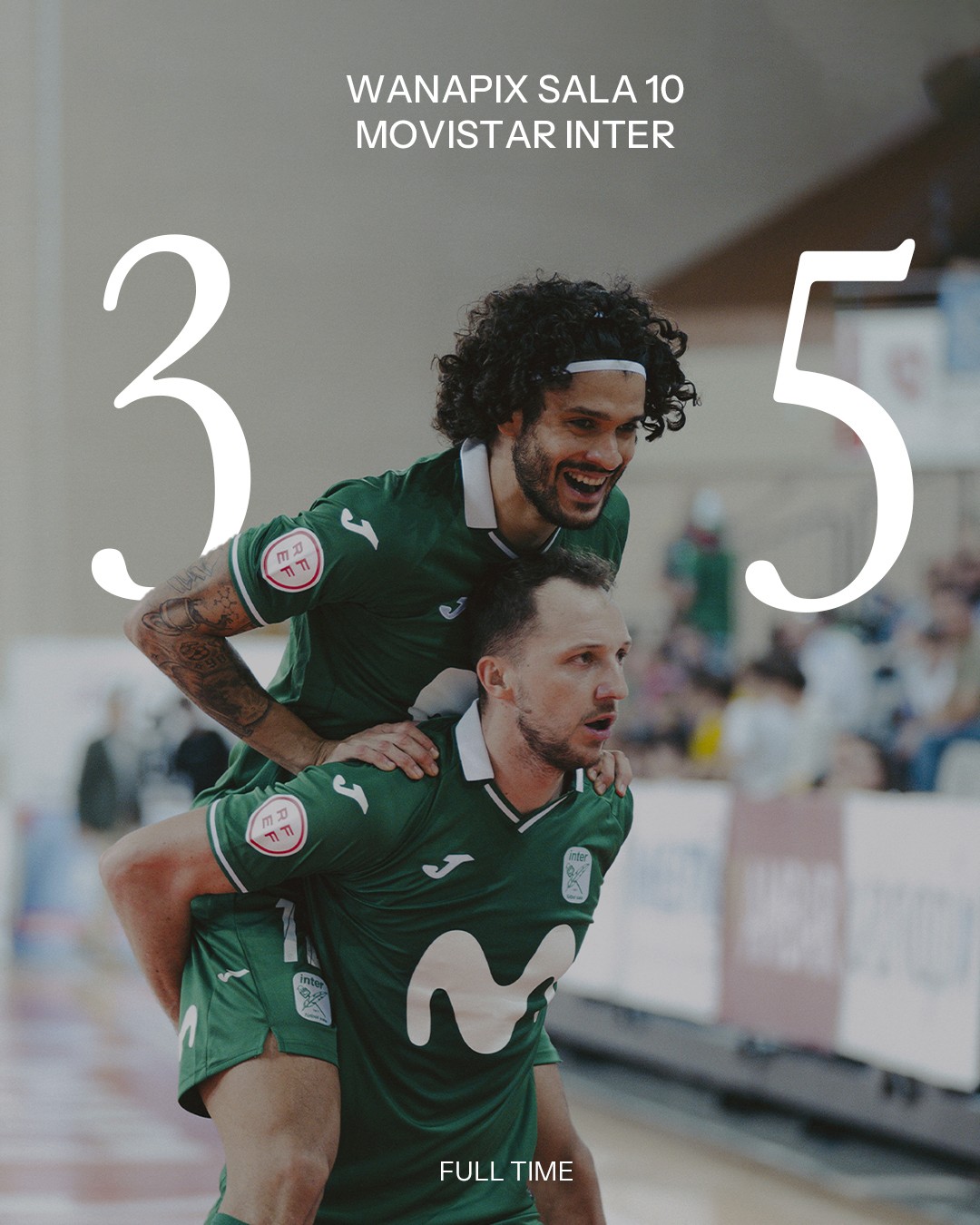 A view of a studio interior with modern decor, featuring large windows that offer a glimpse of lush greenery outside