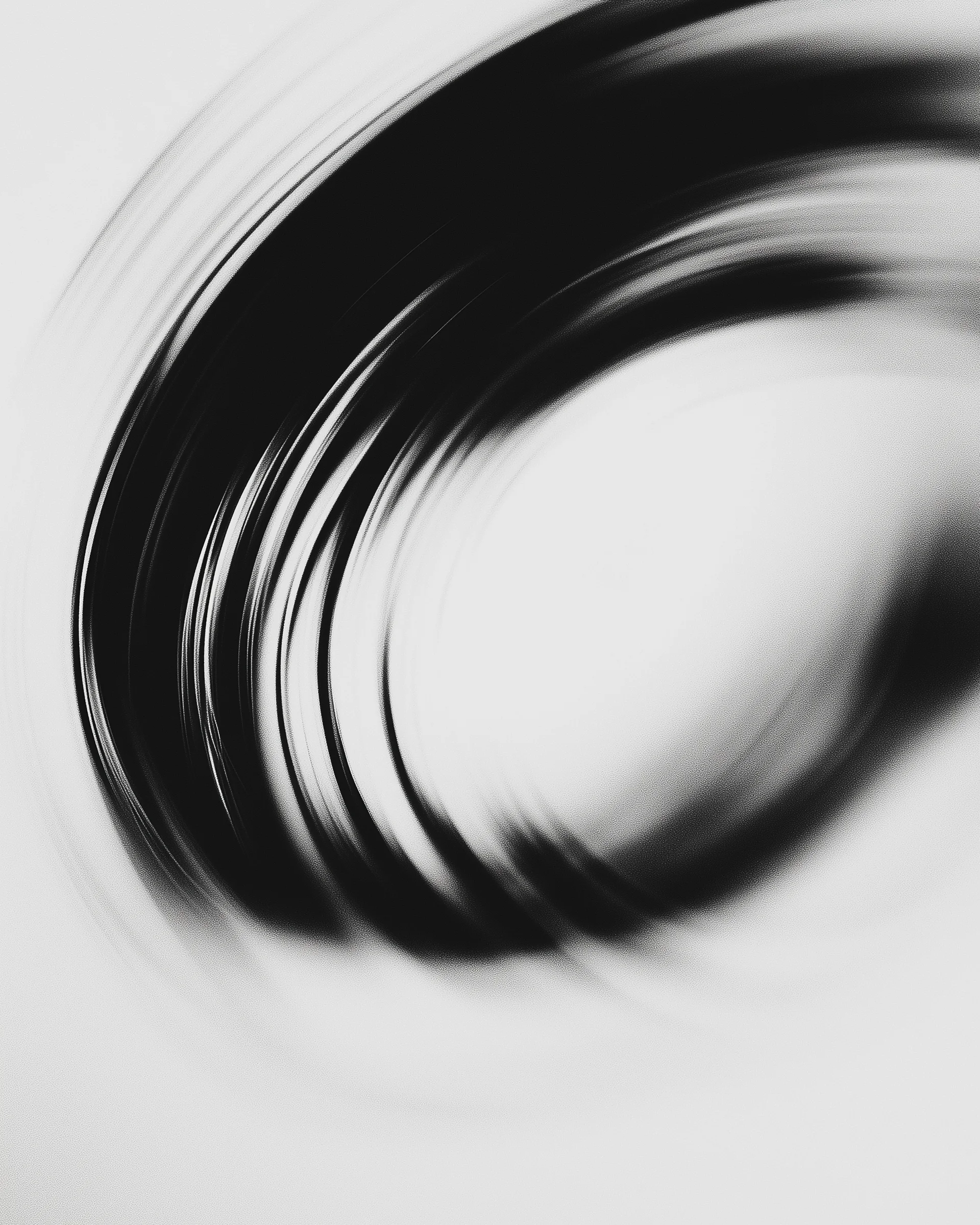 Morrow Chocolate brand artwork: black and white motion-blur photograph of a black band curving around a bright oval centre