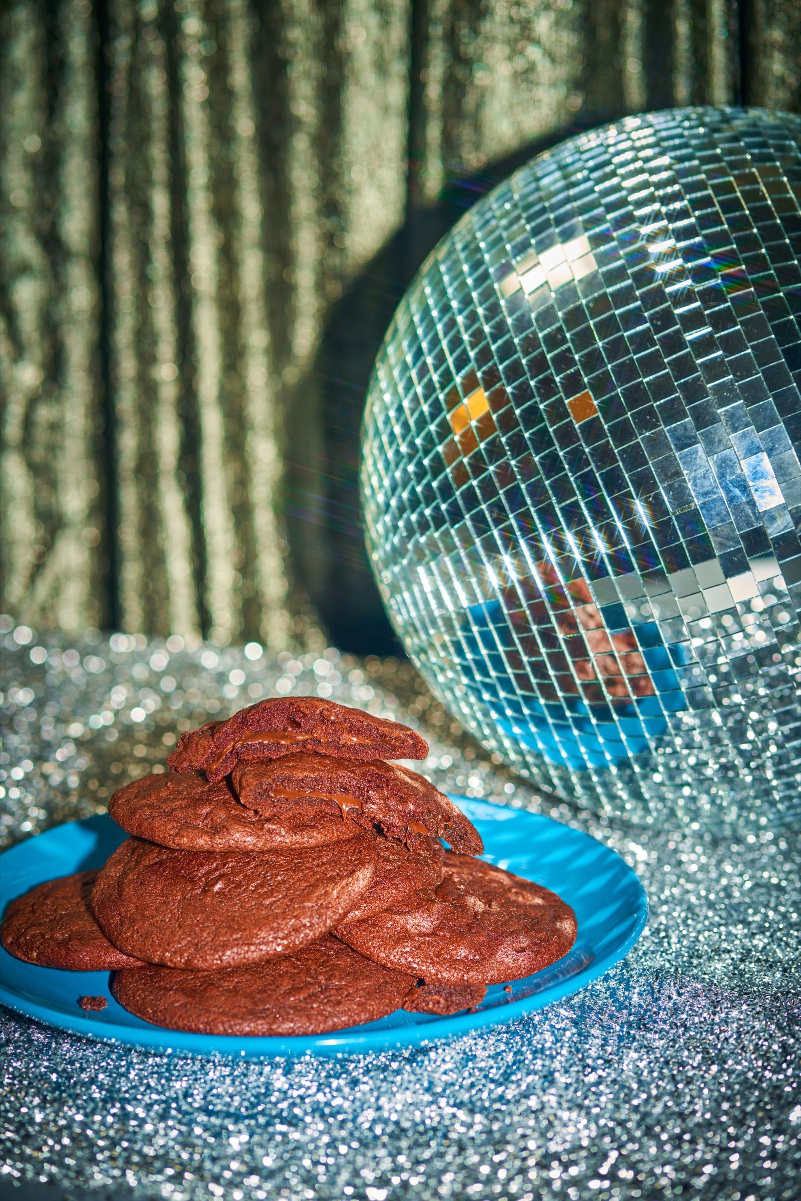 Disco ball and sliced meat still life for Paddy’s Pub