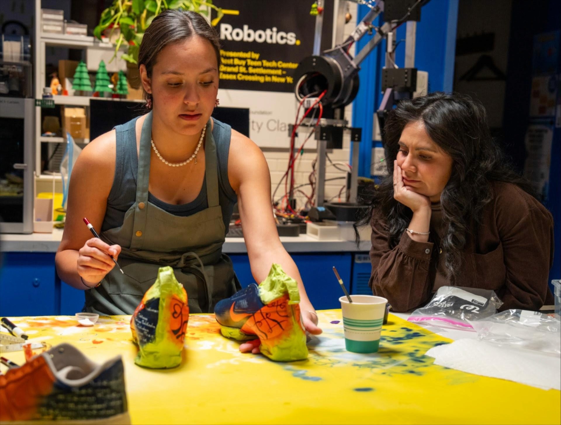 Bella Sanchez works on her custom cleat design.