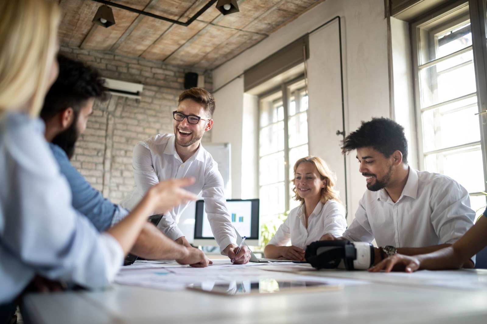 Group of people smiling and having fun during a meeting